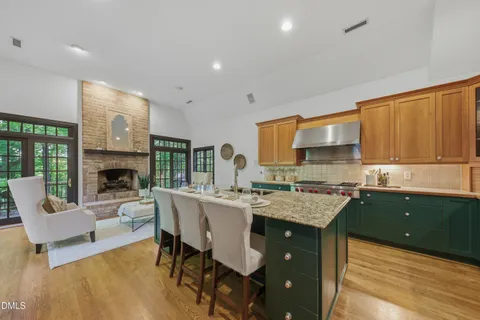 a kitchen with stainless steel appliances a sink dishwasher a stove and cabinets