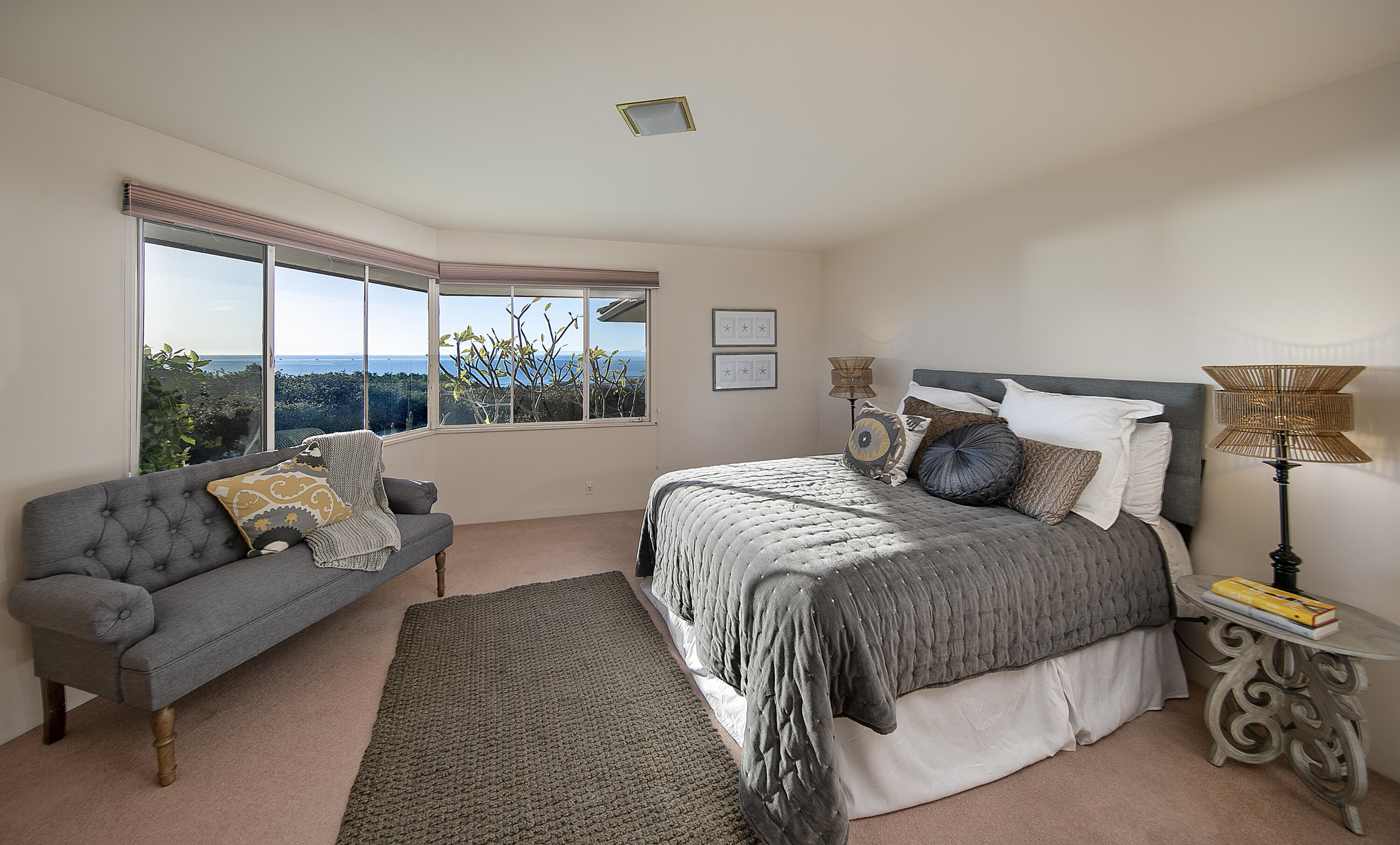 1320 Mission Ridge Road Santa Barbara, CA 93103 - Photo 18 of 27 a bedroom with a bed couch and a large window