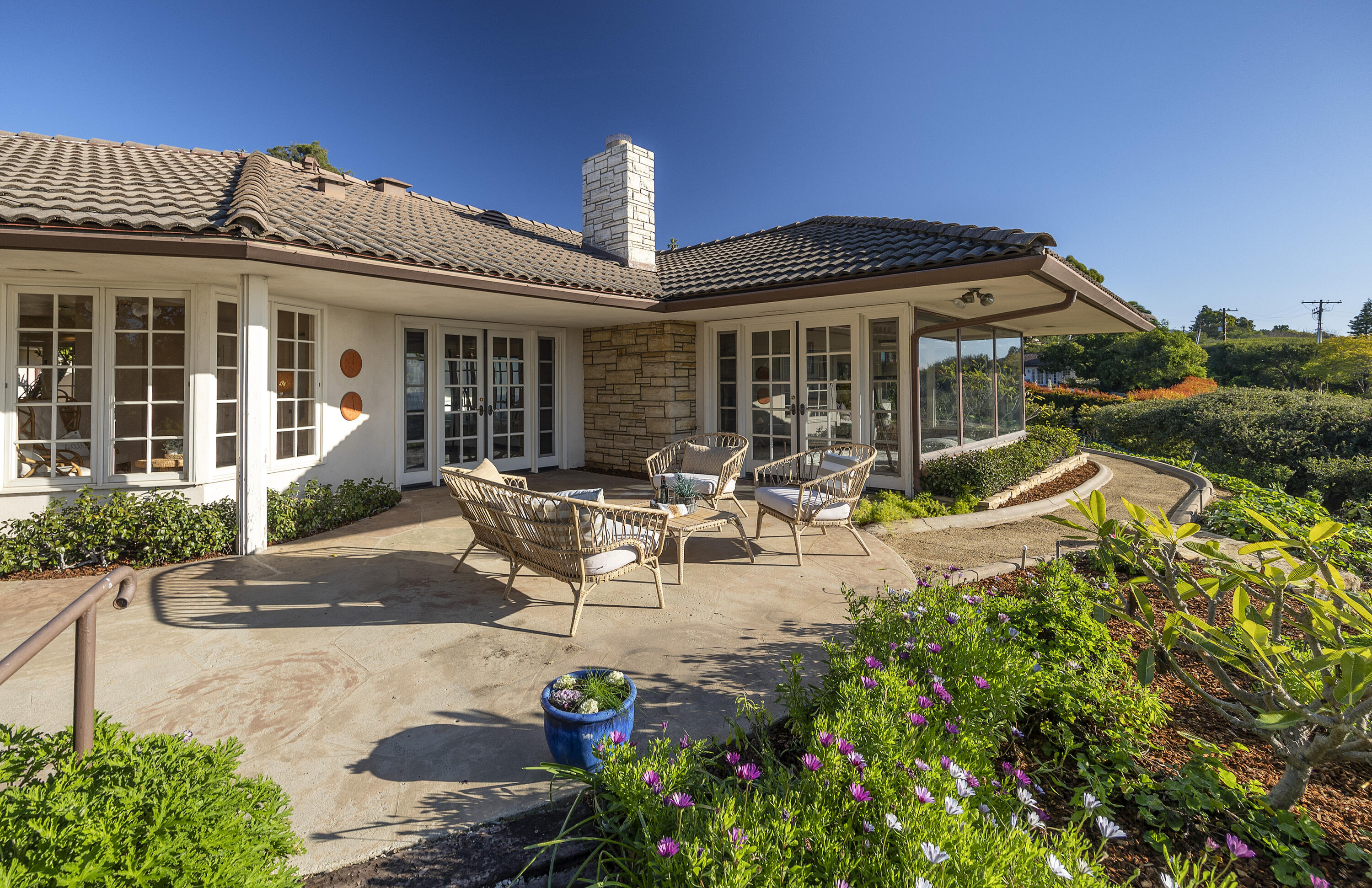 1320 Mission Ridge Road Santa Barbara, CA 93103 - Photo 3 of 27 a front view of a house with sitting area and garden