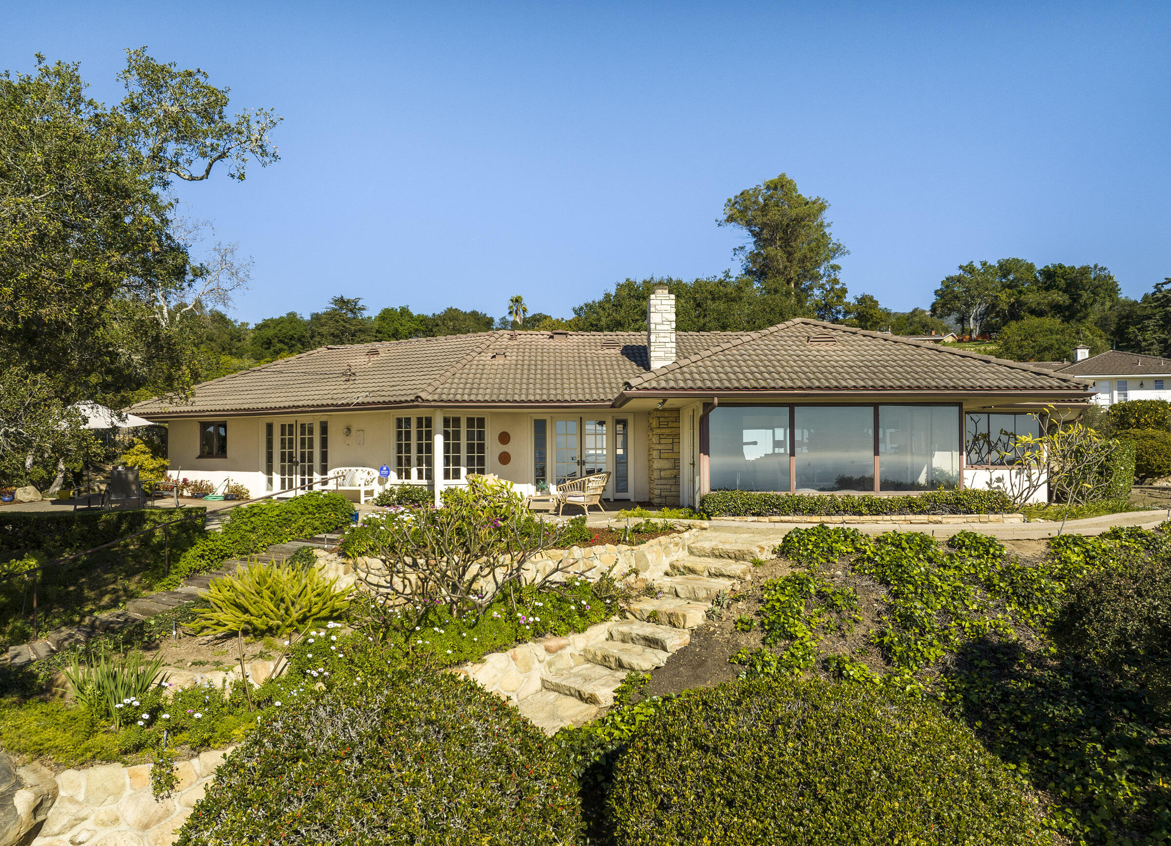 1320 Mission Ridge Road Santa Barbara, CA 93103 - Photo 4 of 27 a front view of a house with a yard
