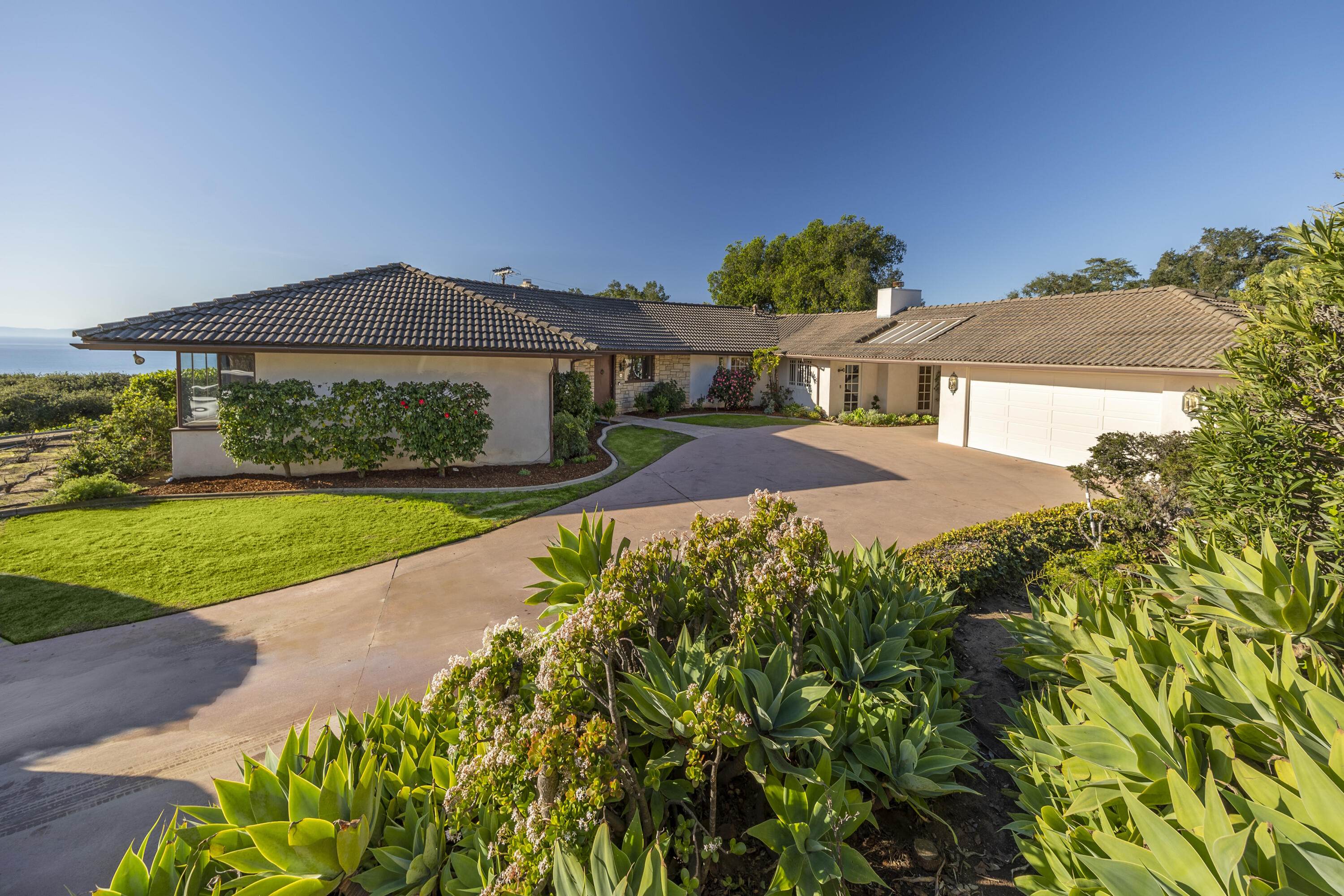 1320 Mission Ridge Road Santa Barbara, CA 93103 - Photo 5 of 27 a front view of a house with a yard