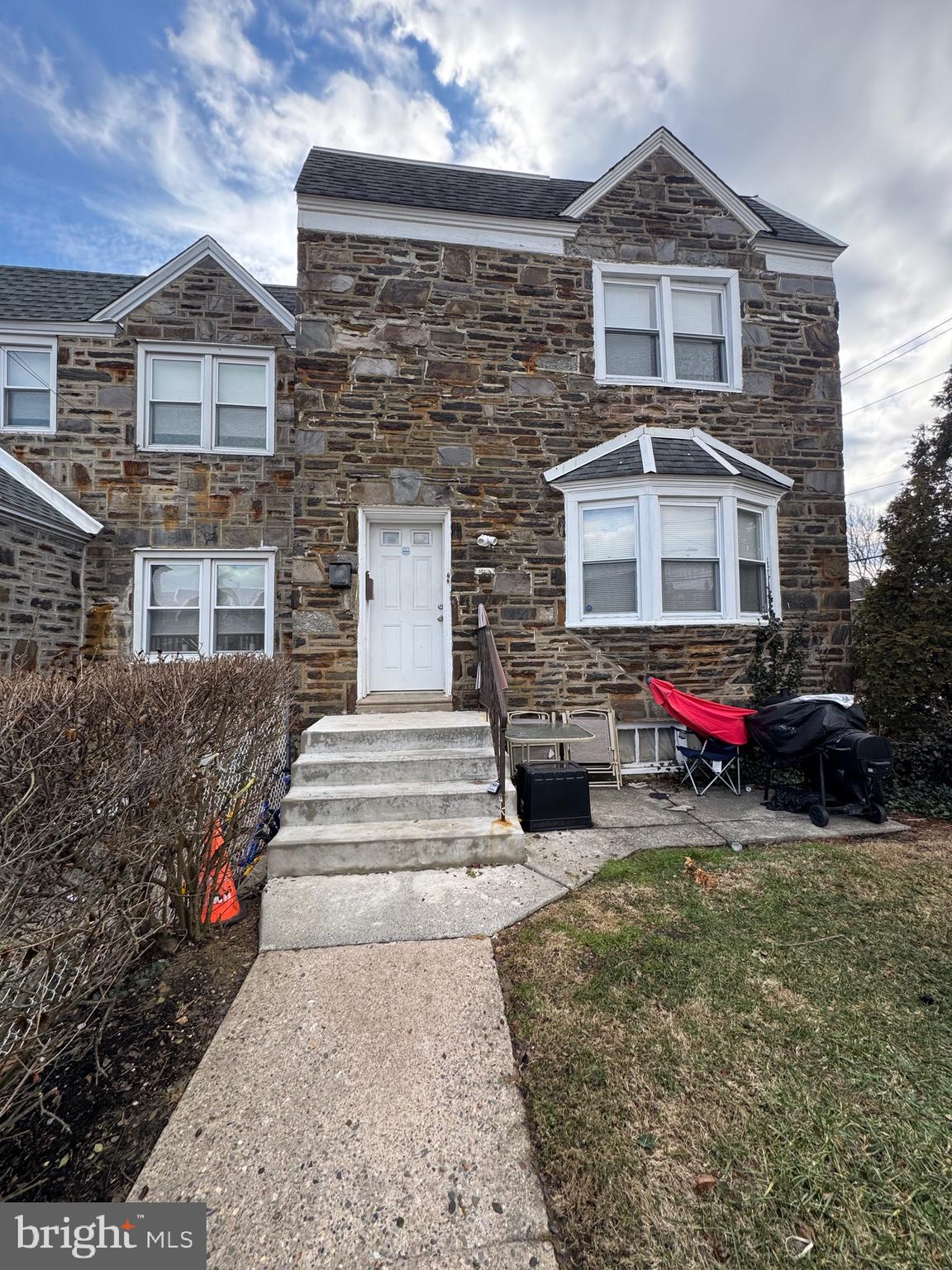 8340 Temple Road Philadelphia, PA 19150 - Photo 1 of 6 a front view of a house with a yard and garage