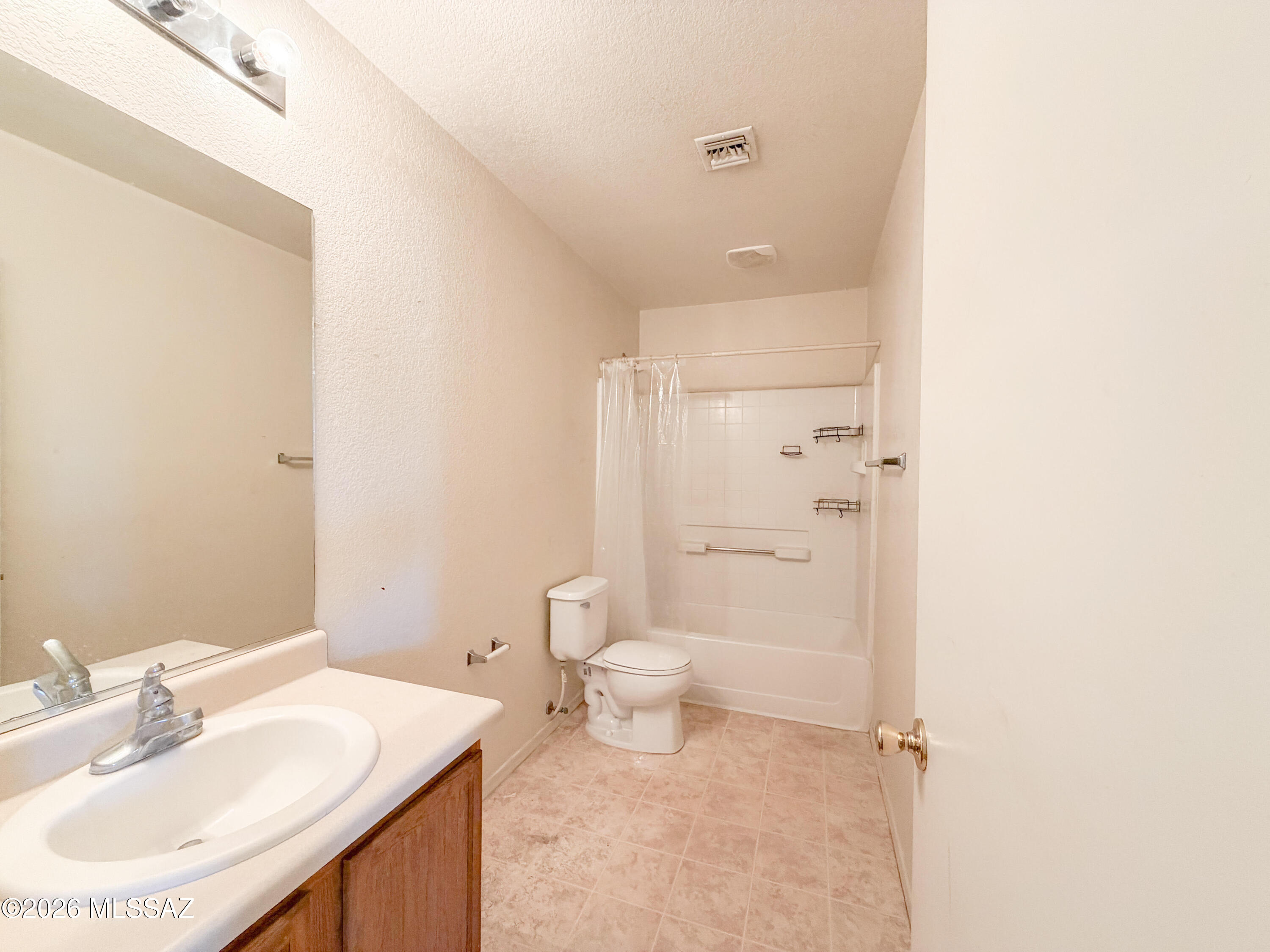 5779 South Manta Ray Road Tucson, AZ 85706 - Photo 21 of 30 a bathroom with a sink toilet and shower
