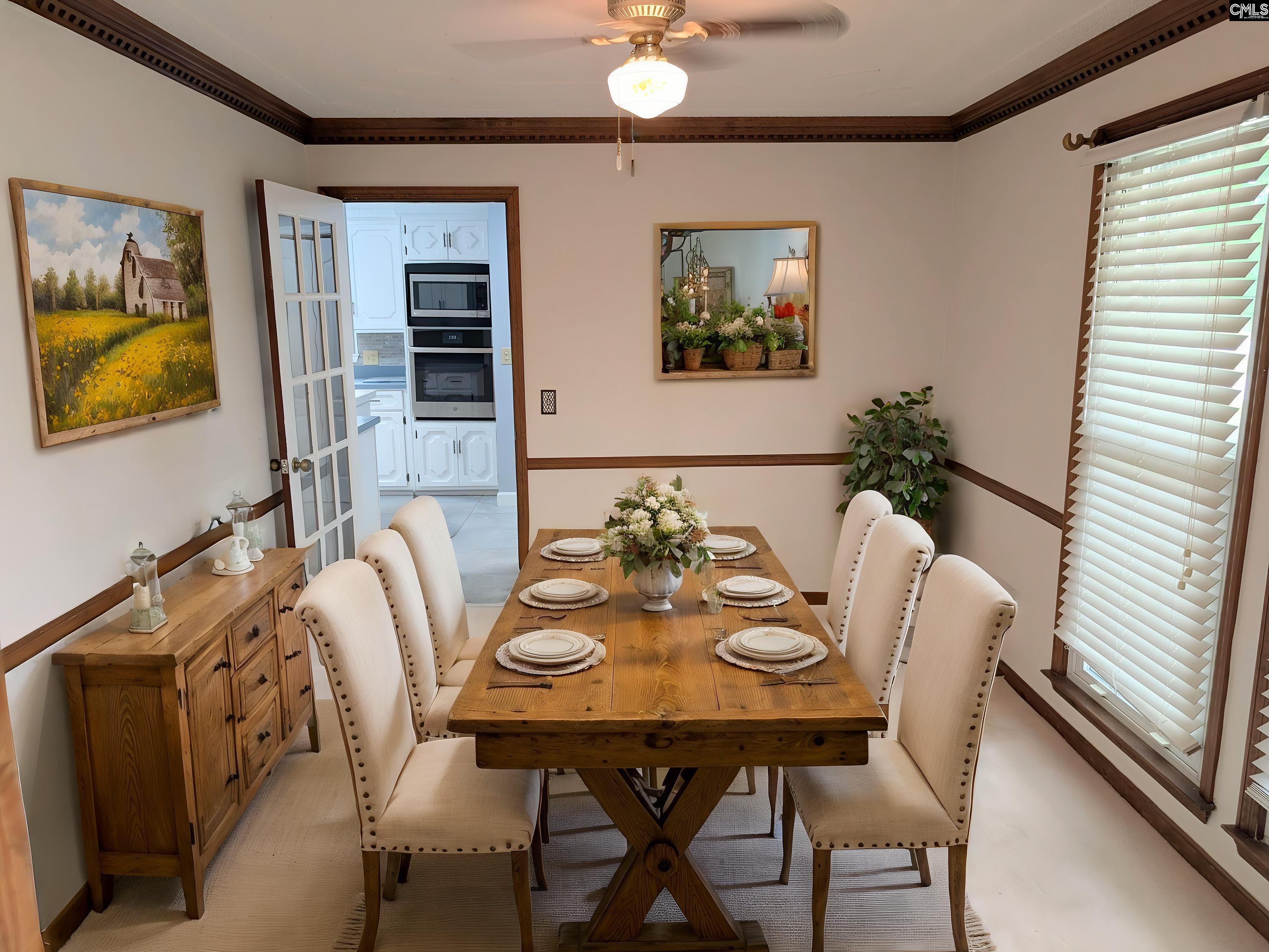 100 Welsh Court Lexington, SC 29073 - Photo 9 of 27 a view of a dining room with furniture and chandelier