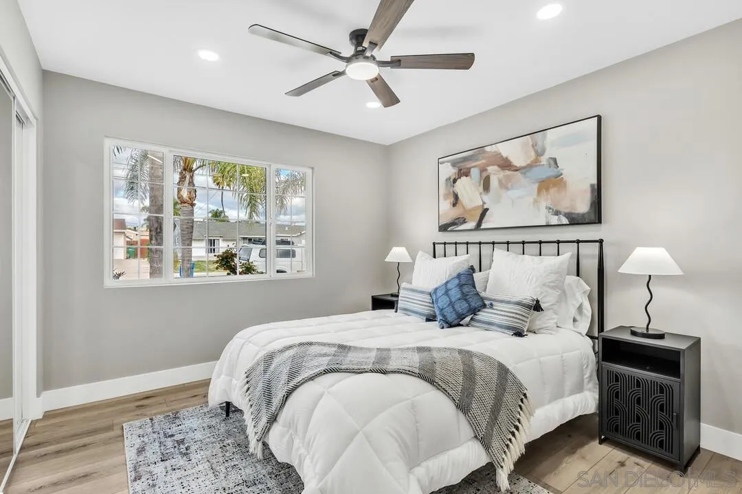9209 Arnaz Way Santee, CA 92071 - Photo 19 of 39 a bedroom with a large bed and a window