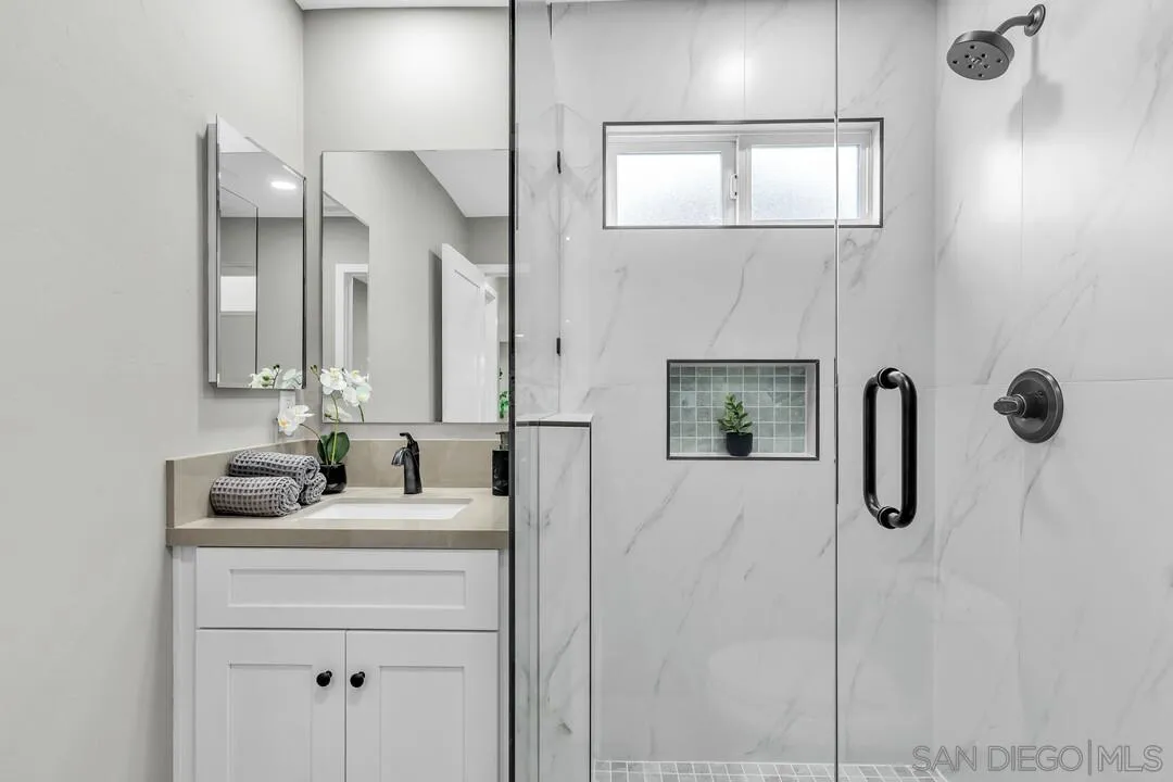 9209 Arnaz Way Santee, CA 92071 - Photo 22 of 39 a bathroom with a double vanity sink