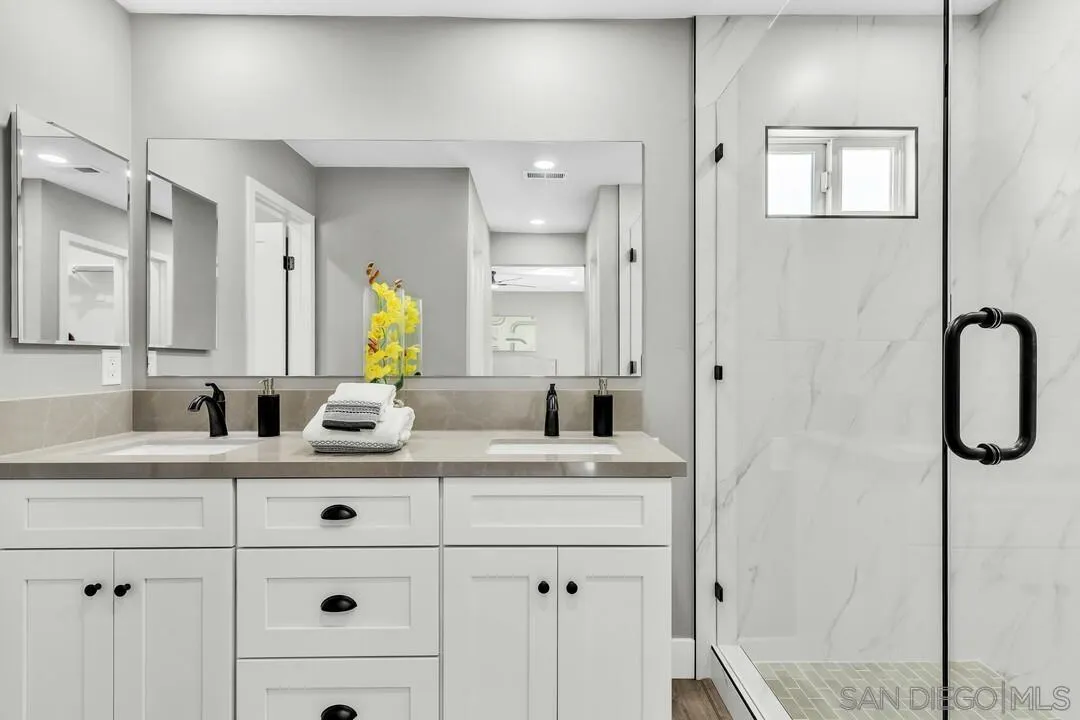 9209 Arnaz Way Santee, CA 92071 - Photo 26 of 39 a bathroom with a sink vanity and mirror