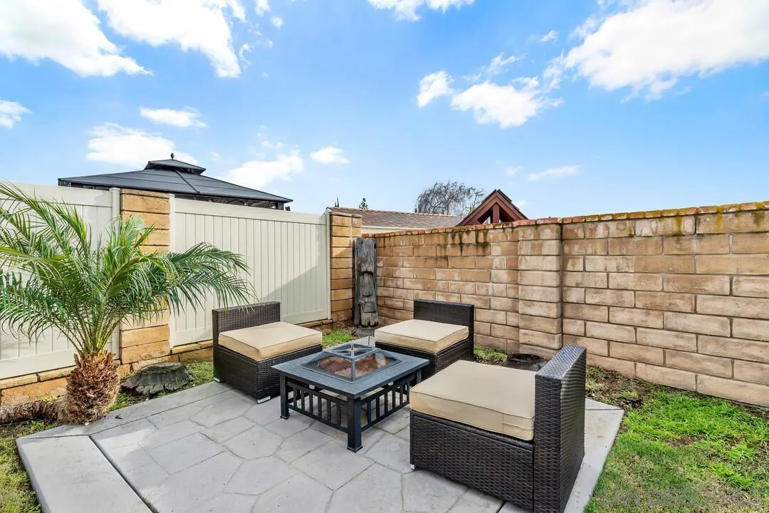 9209 Arnaz Way Santee, CA 92071 - Photo 33 of 39 a backyard of a house with table and chairs