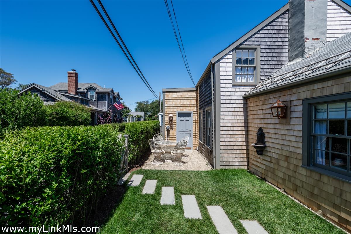 10 Centre Street Nantucket, MA 02554 - Photo 3 of 43 a view of a porch in front of house