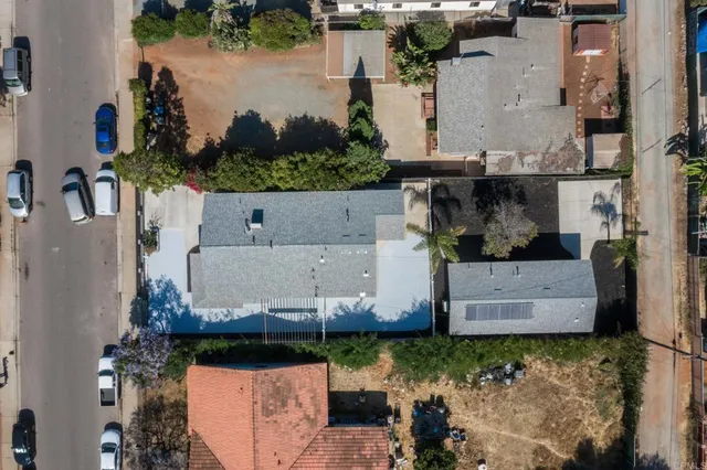 an aerial view of residential houses with outdoor space