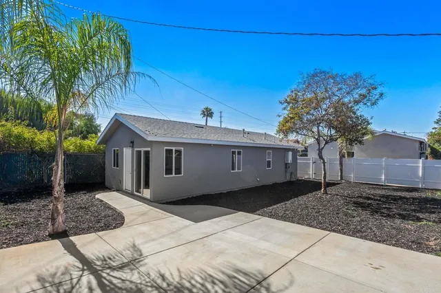 a kitchen with stainless steel appliances a refrigerator and a stove top oven