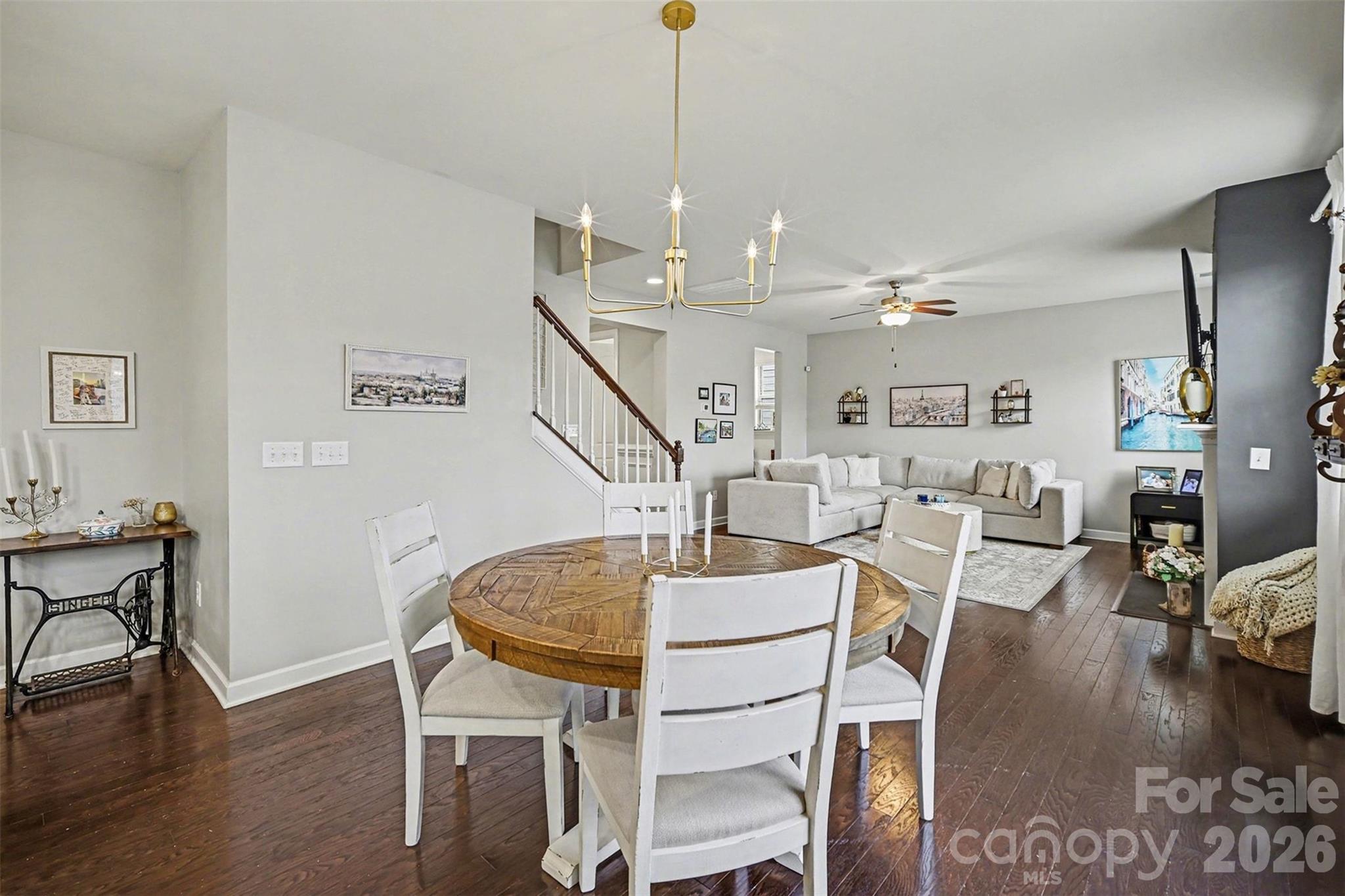 18314 McKee Road Charlotte, NC 28278 - Photo 12 of 37 a living room with furniture a dining table and wooden floor