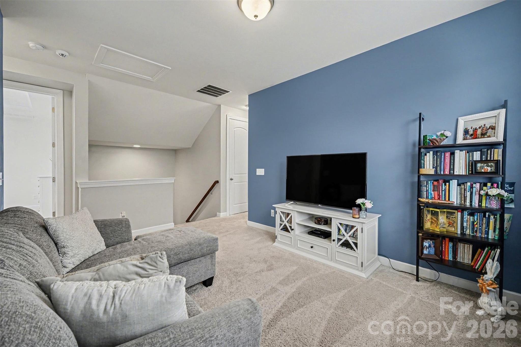 18314 McKee Road Charlotte, NC 28278 - Photo 22 of 37 a living room with furniture and a flat screen tv