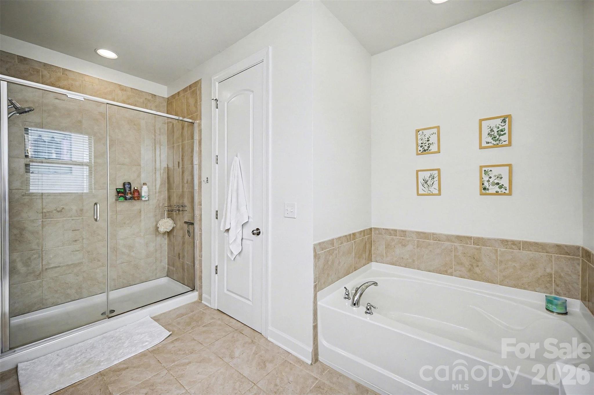 18314 McKee Road Charlotte, NC 28278 - Photo 26 of 37 a bathroom with a bathtub and a shower