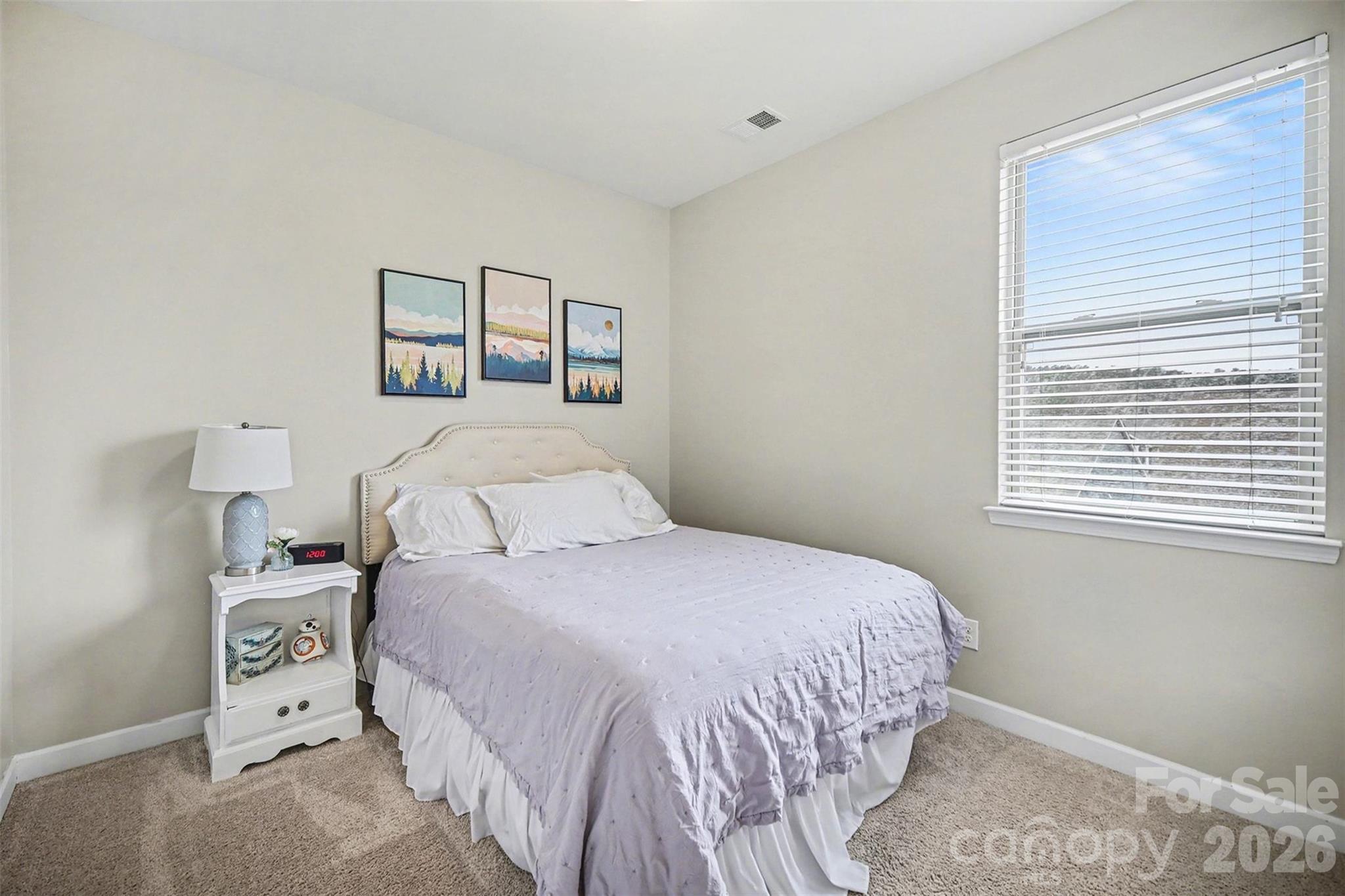 18314 McKee Road Charlotte, NC 28278 - Photo 28 of 37 a bedroom with a bed and a window