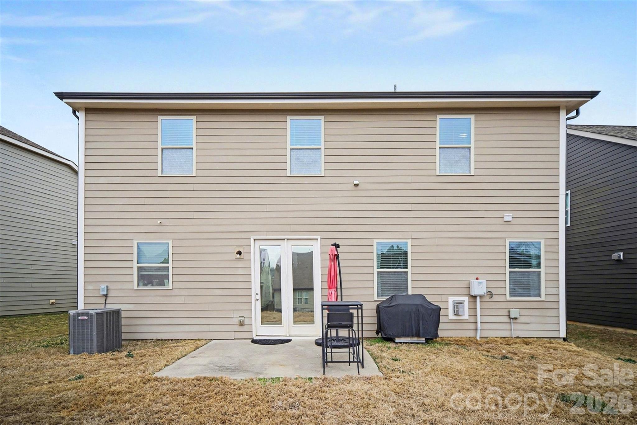 18314 McKee Road Charlotte, NC 28278 - Photo 34 of 37 a backyard of a house with chairs and wooden floor