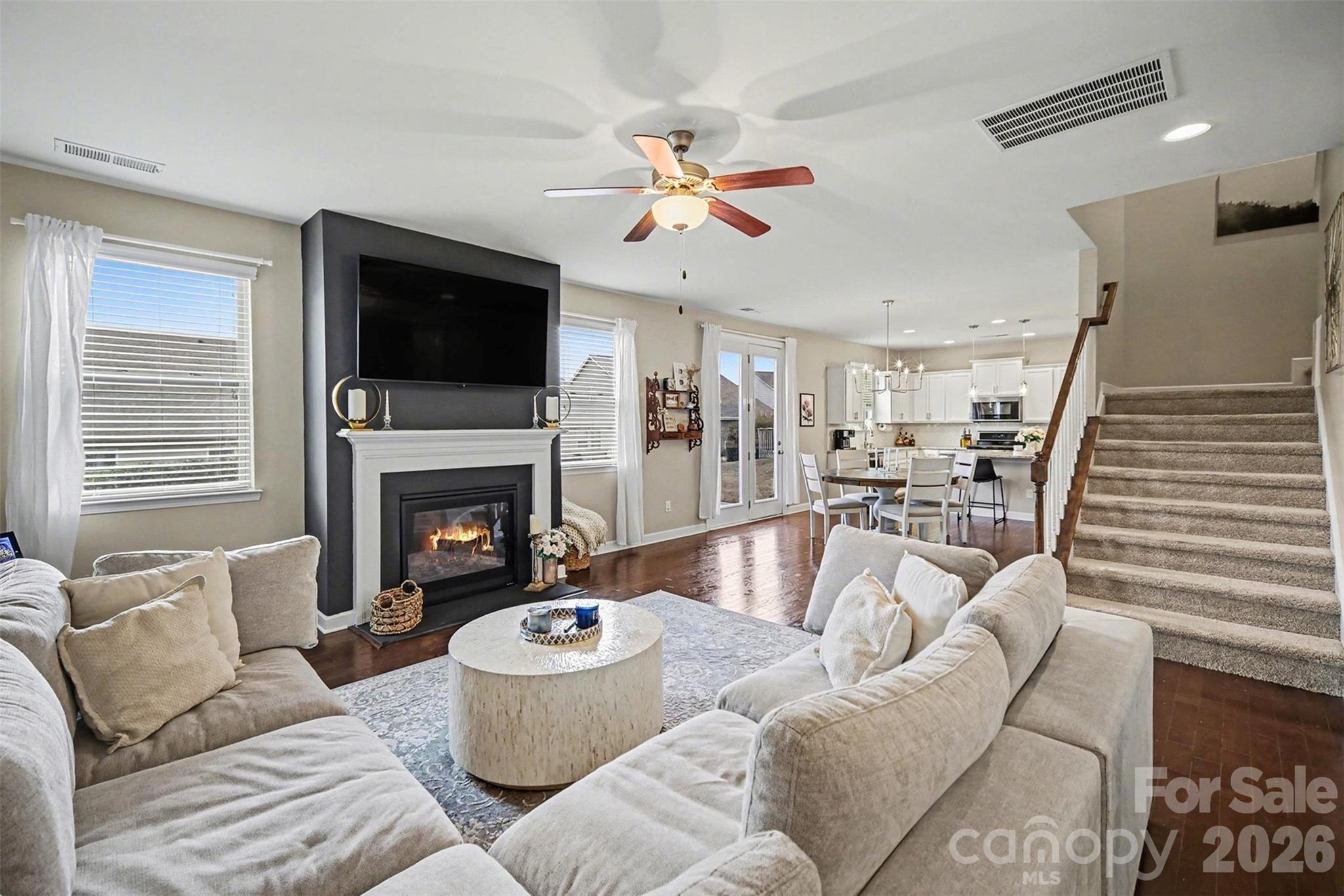 18314 McKee Road Charlotte, NC 28278 - Photo 8 of 37 a living room with furniture fireplace and a flat screen tv