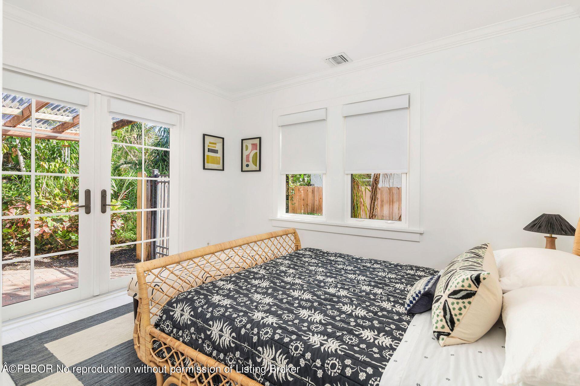 827 Ardmore Road West Palm Beach, FL 33401 - Photo 14 of 27 a bed sitting in a bedroom next to a window