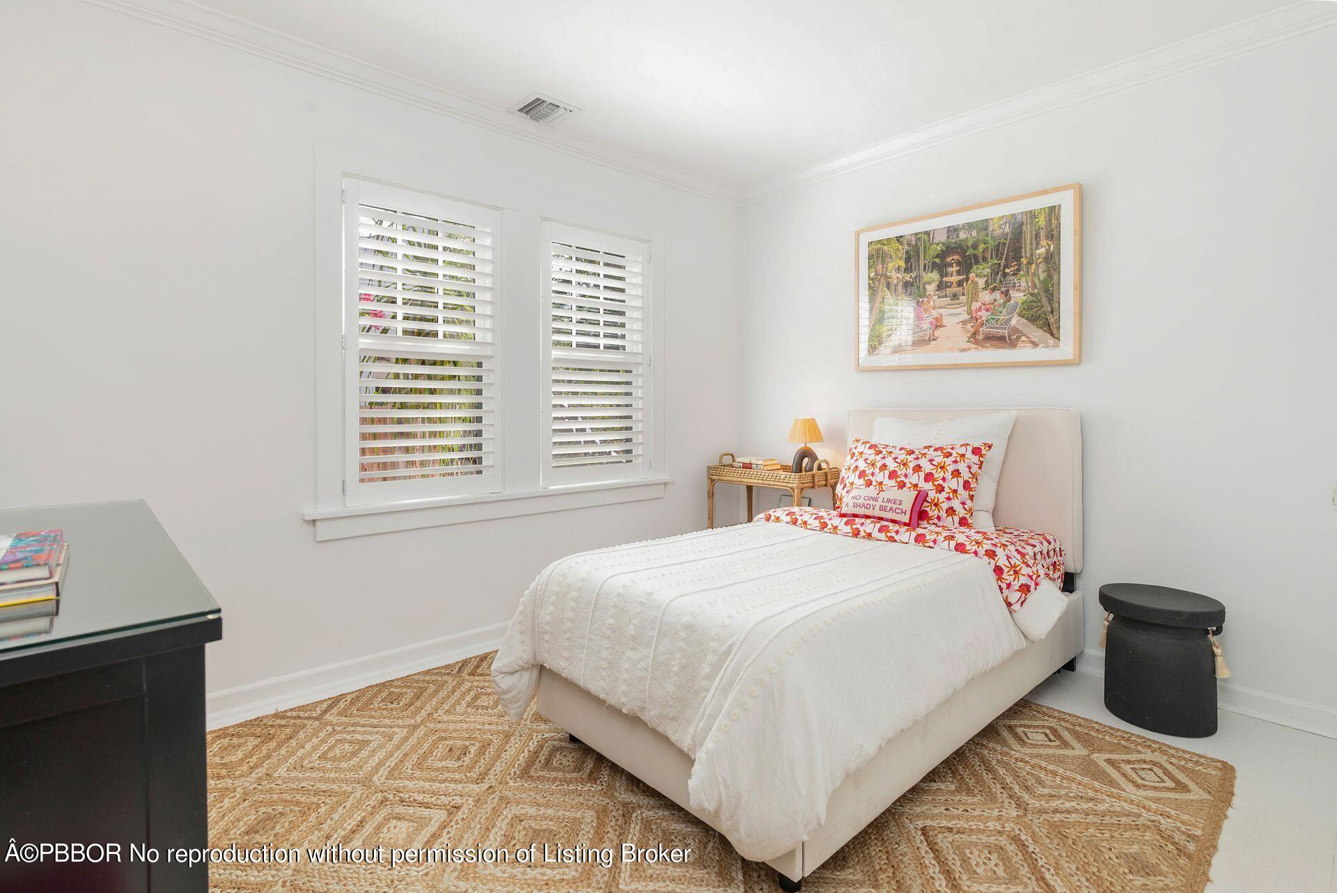827 Ardmore Road West Palm Beach, FL 33401 - Photo 16 of 27 a bedroom with a bed and a window