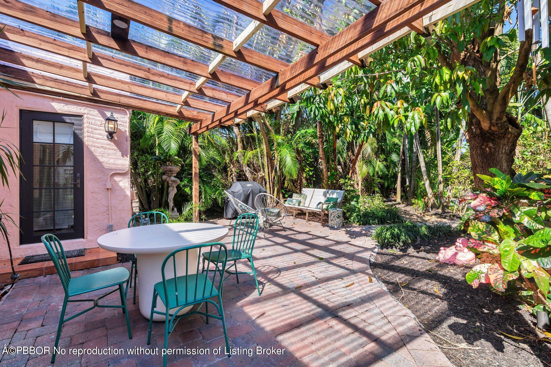 827 Ardmore Road West Palm Beach, FL 33401 - Photo 19 of 27 a view of a patio with table and chairs and potted plants