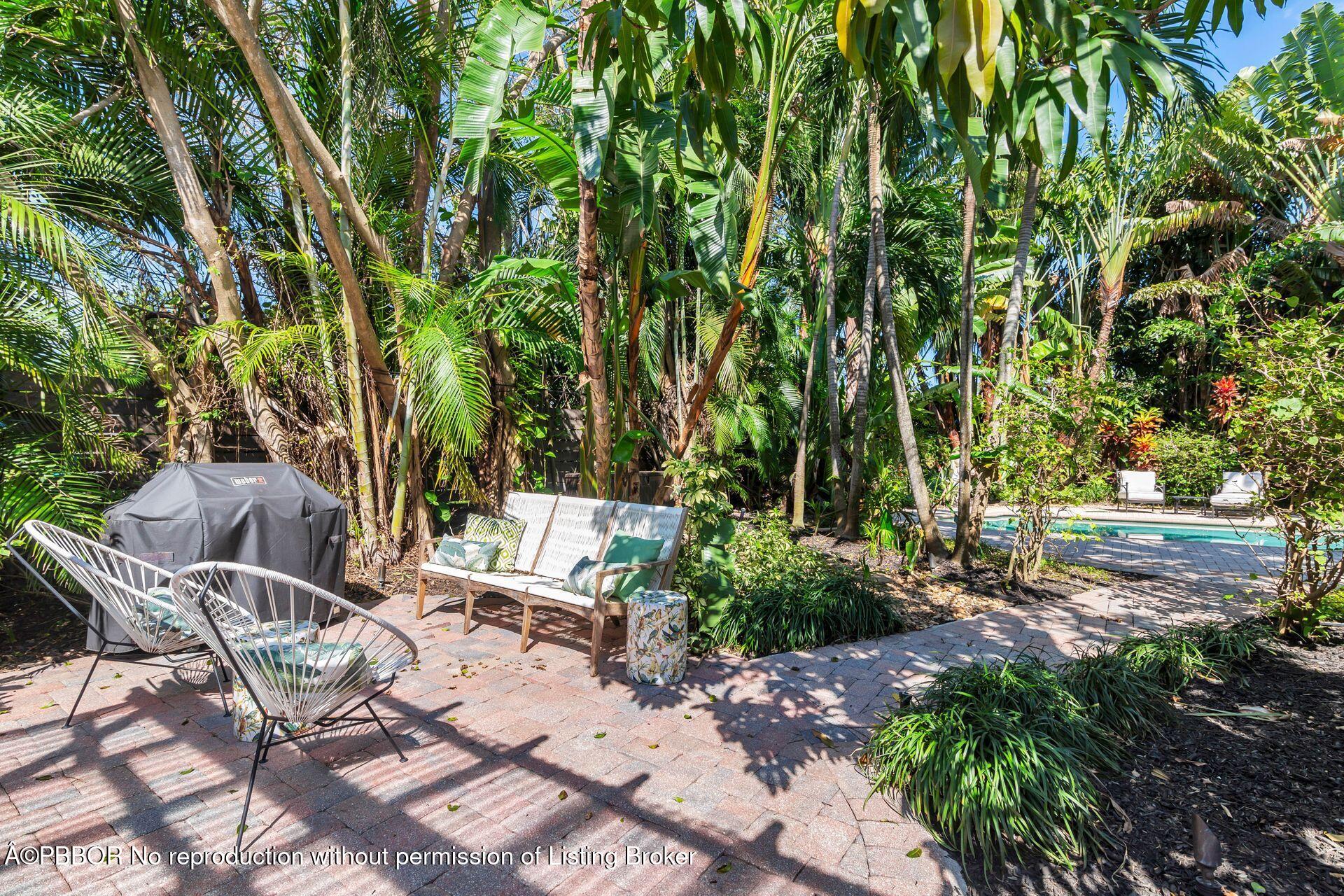 827 Ardmore Road West Palm Beach, FL 33401 - Photo 20 of 27 a view of backyard with table and chairs and potted plants