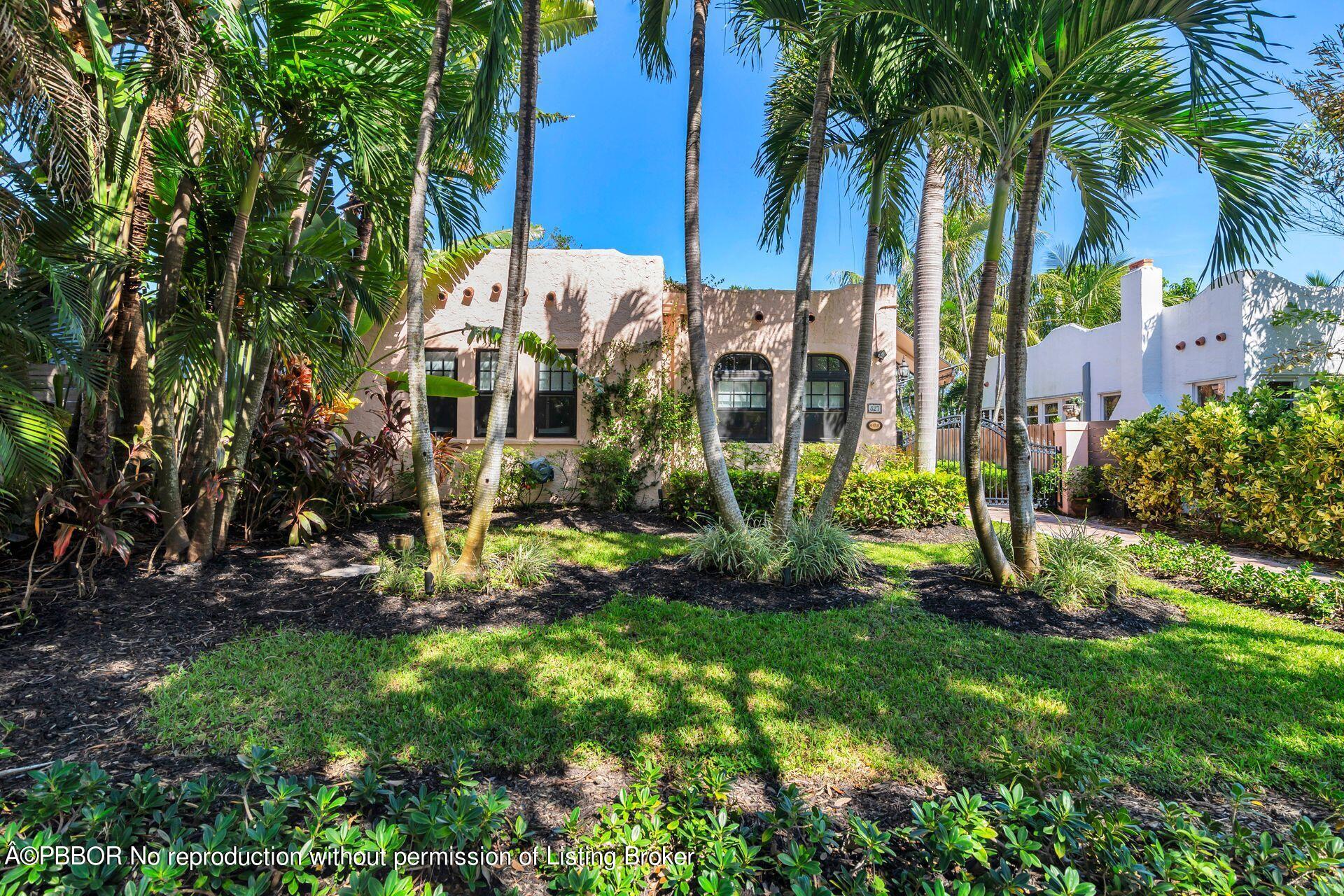827 Ardmore Road West Palm Beach, FL 33401 - Photo 2 of 27 front view of a house with a yard and potted plants