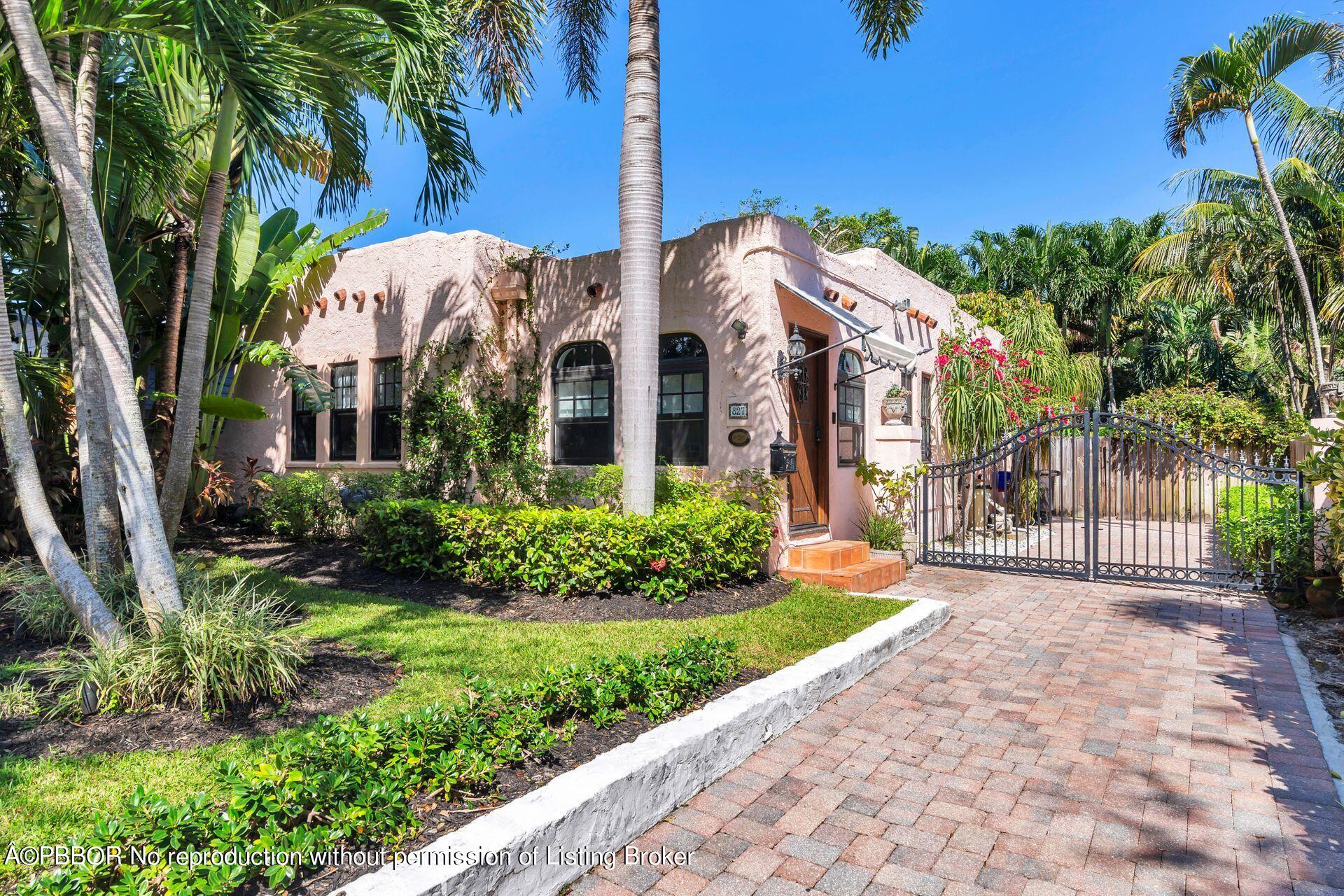 827 Ardmore Road West Palm Beach, FL 33401 - Photo 4 of 27 a front view of a house with a yard and potted plants