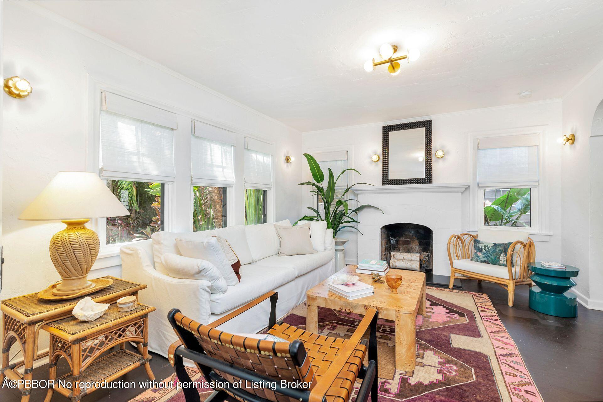 827 Ardmore Road West Palm Beach, FL 33401 - Photo 6 of 27 a living room with furniture potted plant and a fireplace