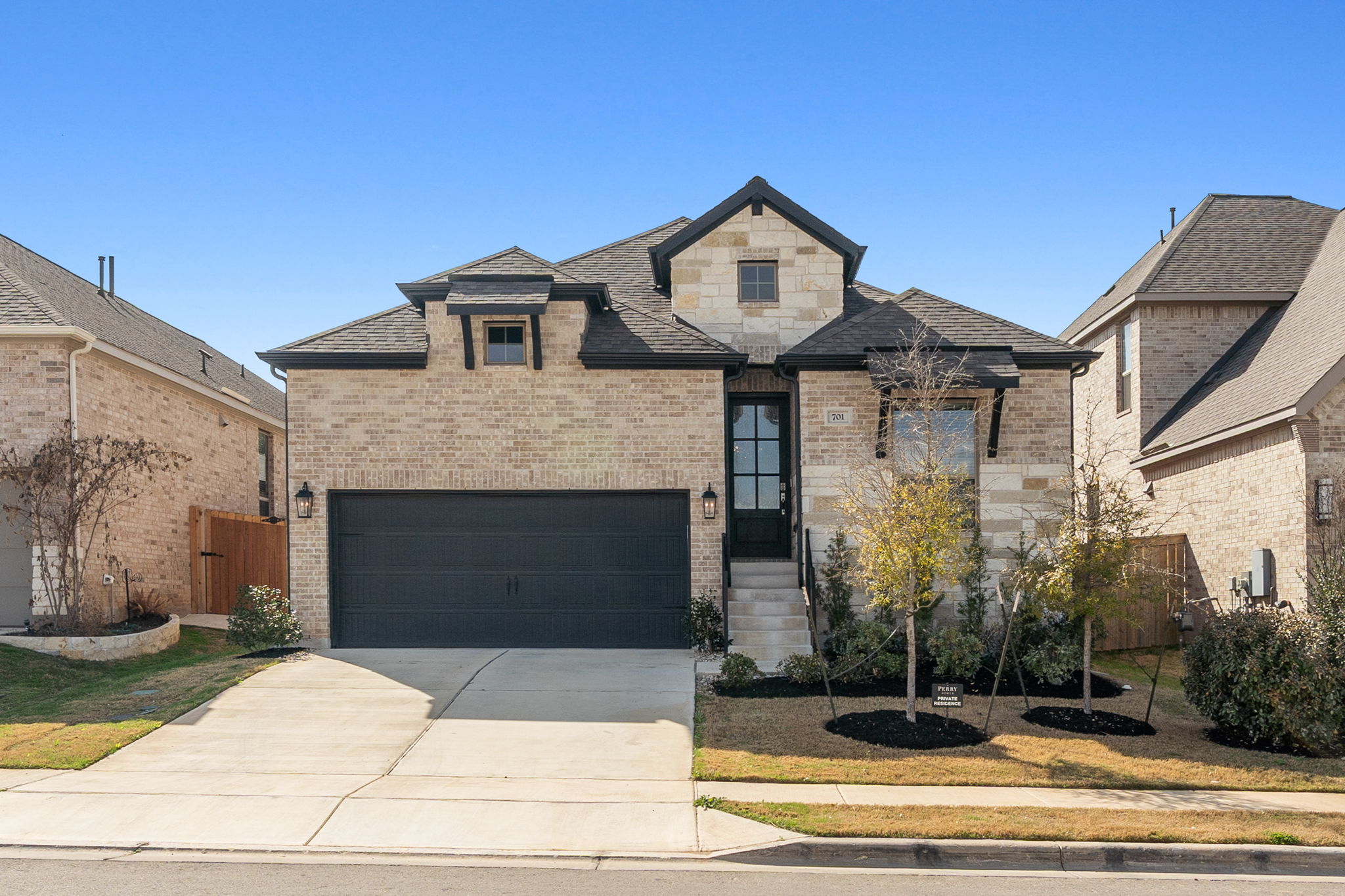 701 Tradewinds Way Georgetown, TX 78628 - Photo 1 of 1 a front view of a house with a garden and plants