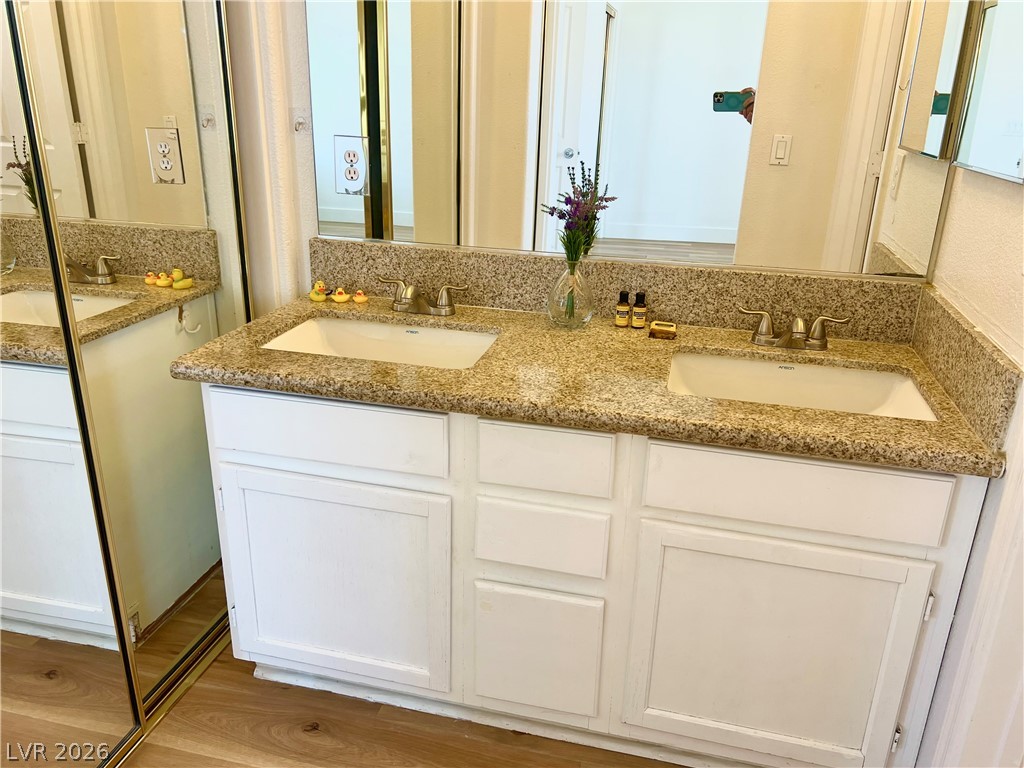 9708 Ridge Creek Place Las Vegas, NV 89134 - Photo 25 of 34 Double vanity with granite counters and white cabinetry enhances this well-appointed bathroom.