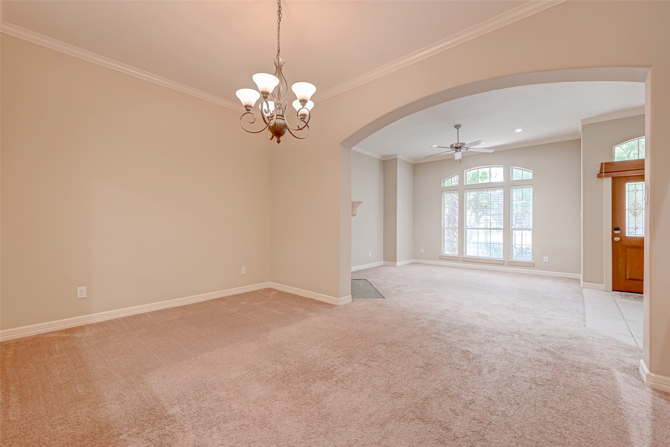 13607 Brookbluff Lane Houston, TX 77077 - Photo 14 of 50 a view of an empty room with a chandelier