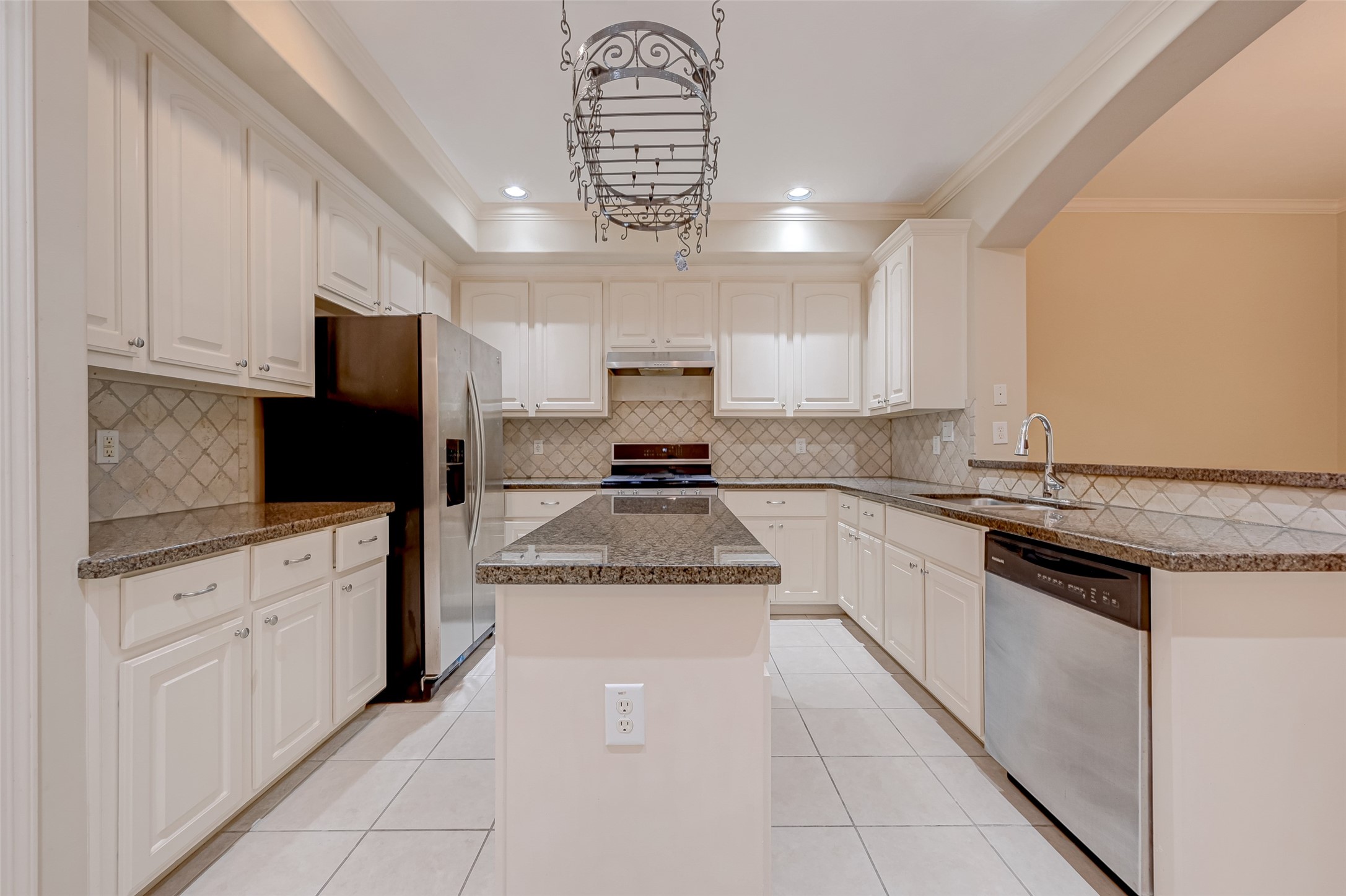 13607 Brookbluff Lane Houston, TX 77077 - Photo 19 of 50 a kitchen with granite countertop stainless steel appliances and white cabinets