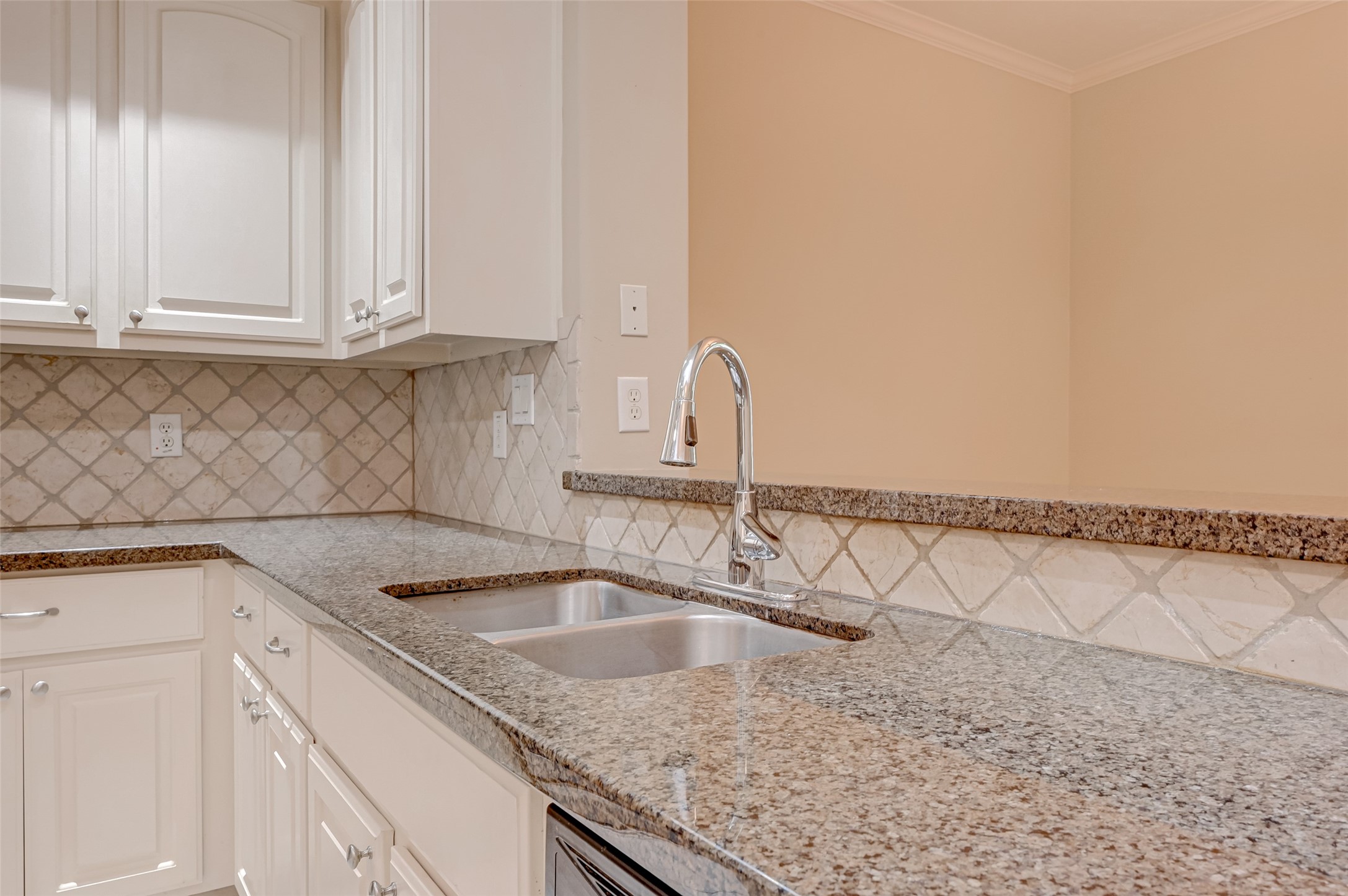 13607 Brookbluff Lane Houston, TX 77077 - Photo 22 of 50 a kitchen with a sink and cabinets