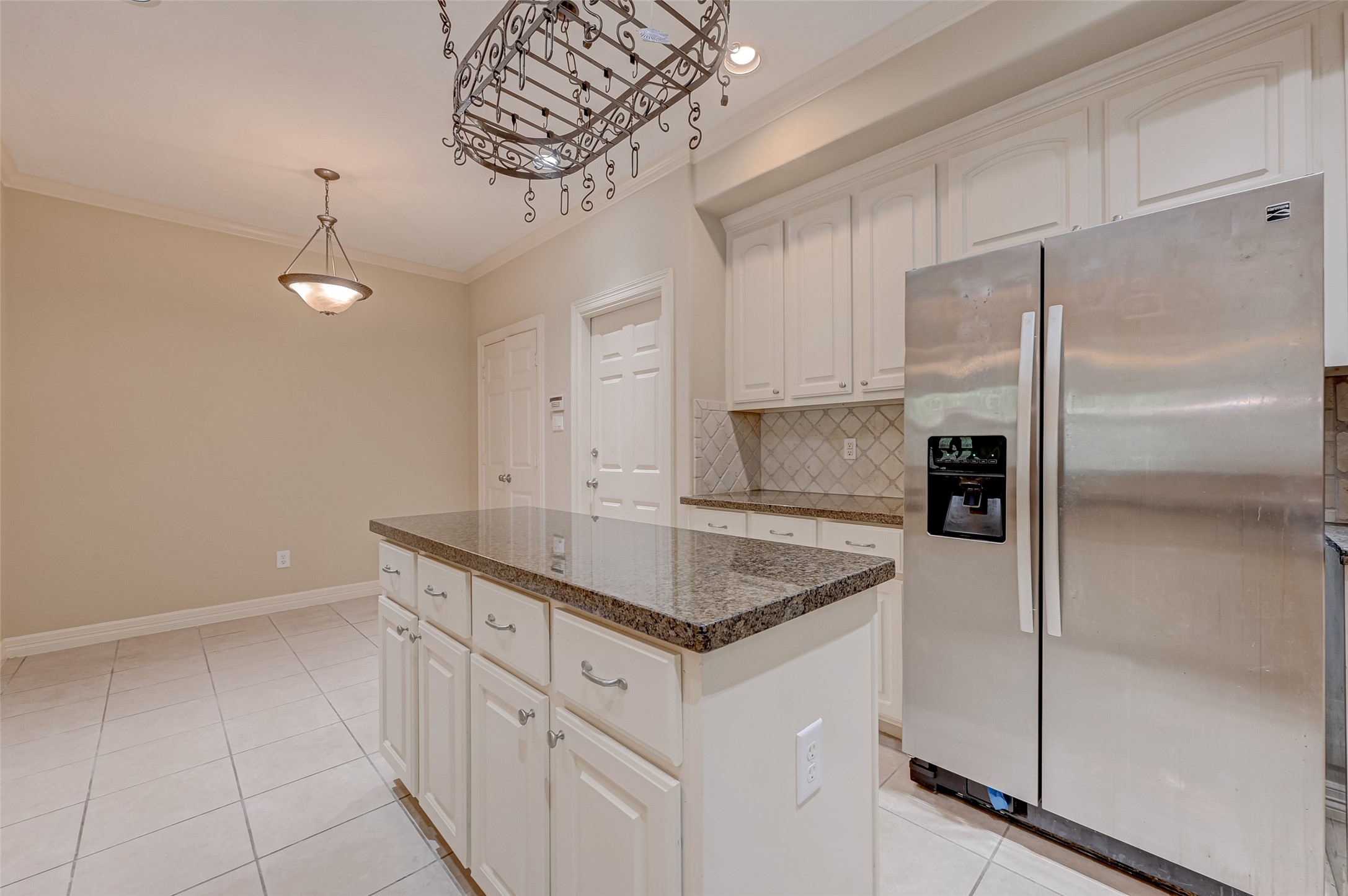 13607 Brookbluff Lane Houston, TX 77077 - Photo 25 of 50 a kitchen with stainless steel appliances granite countertop a sink a refrigerator and a counter top space
