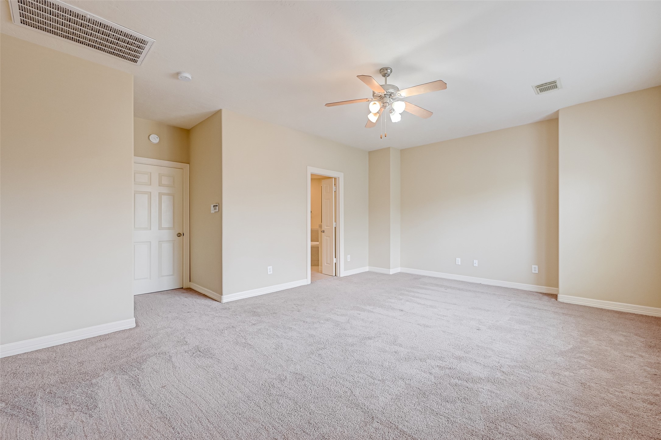 13607 Brookbluff Lane Houston, TX 77077 - Photo 37 of 50 a view of an empty room with a ceiling fan