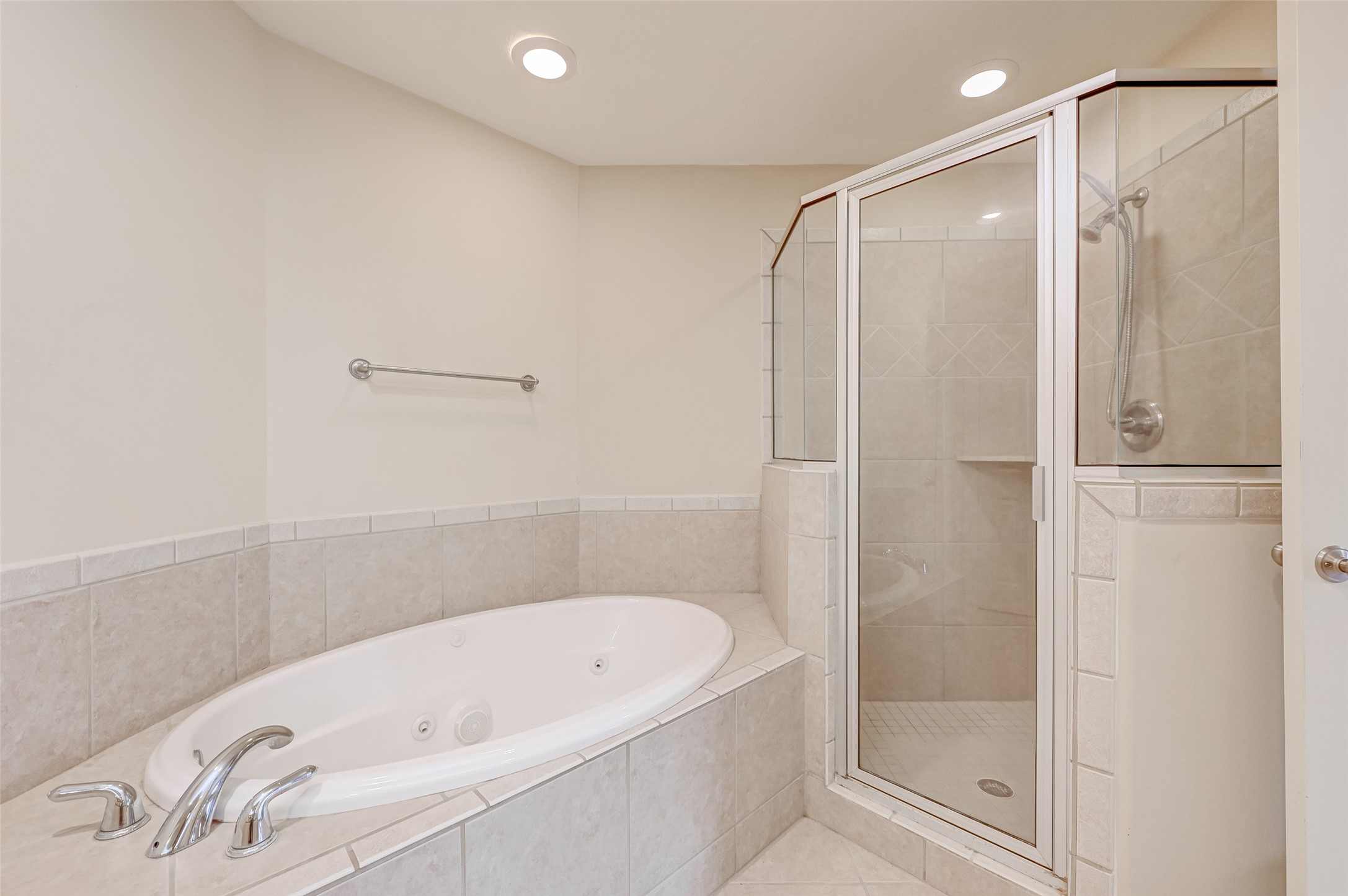 13607 Brookbluff Lane Houston, TX 77077 - Photo 42 of 50 a bathroom with a bathtub and a shower