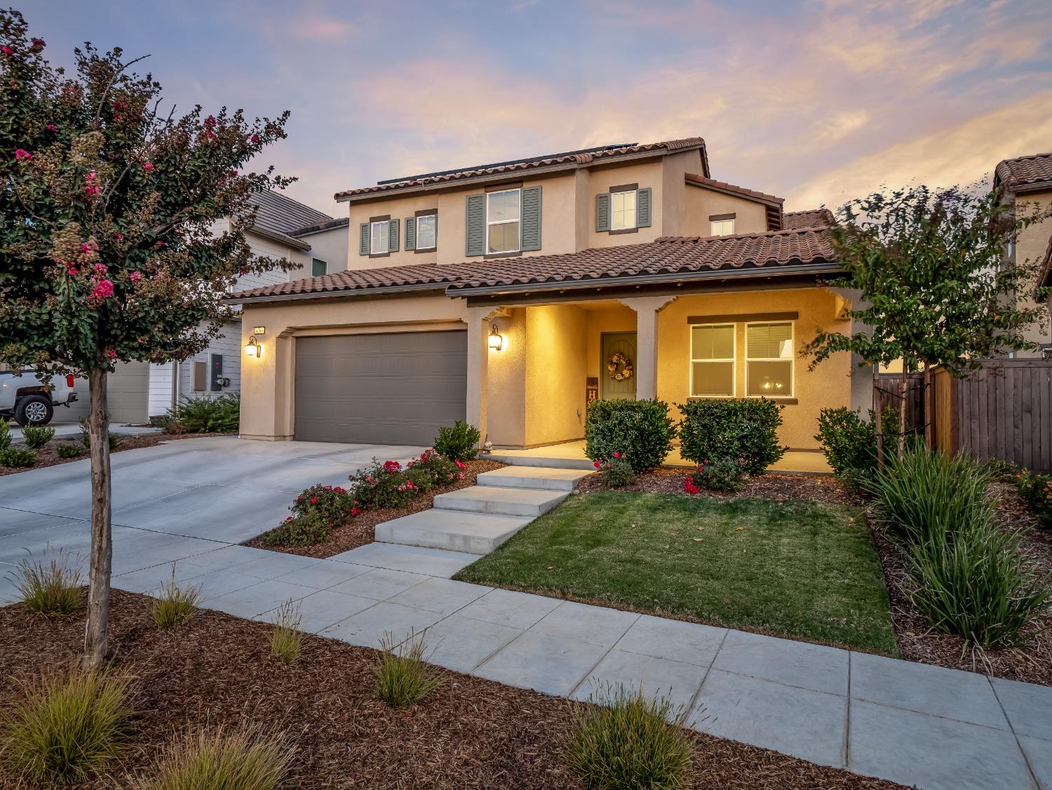 a front view of a house with garden