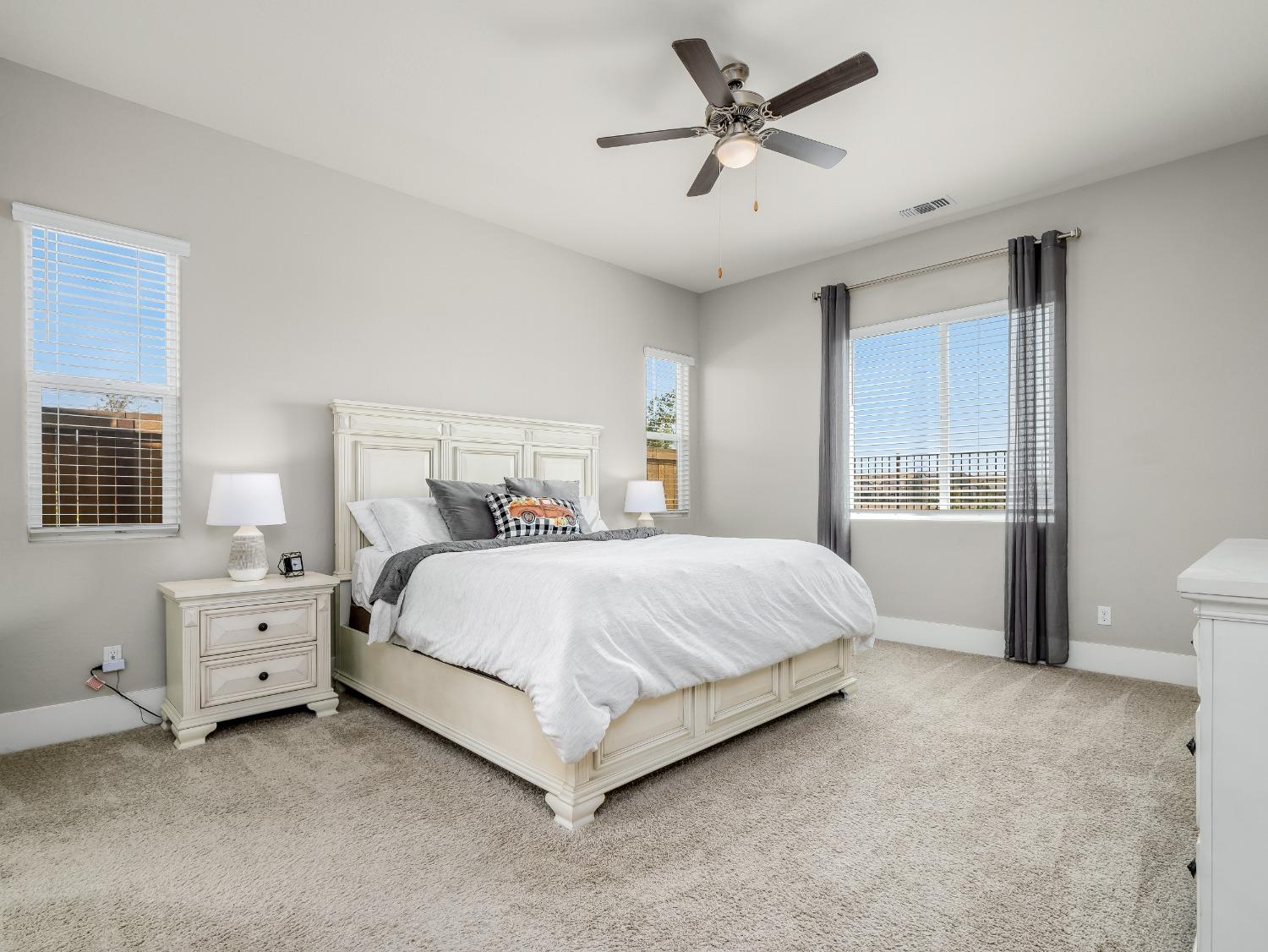 4289 Vineyard Drive Madera, CA 93636 - Photo 13 of 37 a bedroom with bed and window