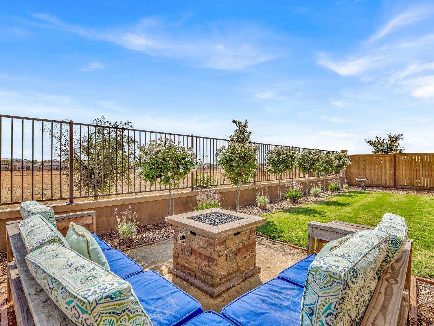 4289 Vineyard Drive Madera, CA 93636 - Photo 30 of 37 a view of a patio with couches chairs and a yard