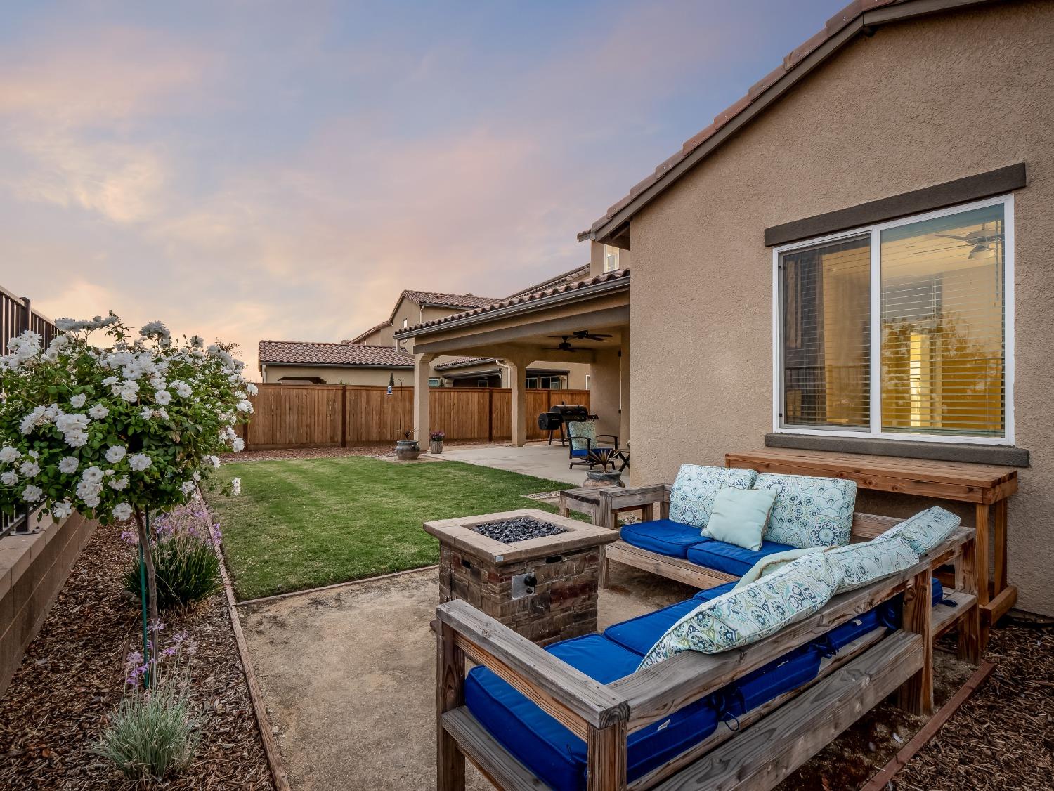 4289 Vineyard Drive Madera, CA 93636 - Photo 33 of 37 a car parked in front of a house with a yard