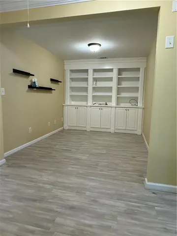 a view of a room with shelf on the wall