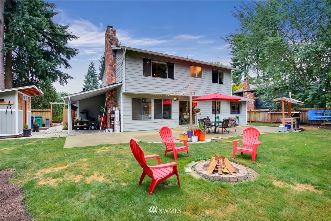 2327 168th Street Southeast Bothell, WA 98012 - Photo 24 of 25 a front view of a house with a yard table and chairs