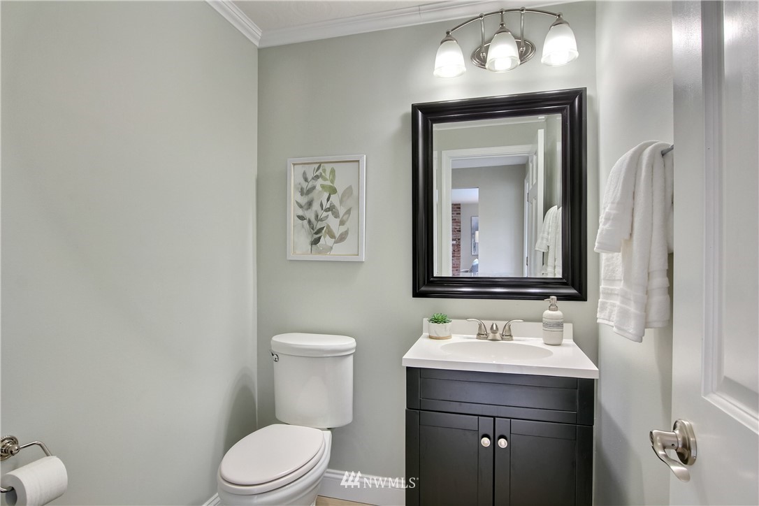 2327 168th Street Southeast Bothell, WA 98012 - Photo 4 of 25 a bathroom with a toilet sink and mirror