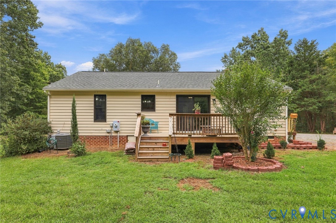 133 Ford Road Bumpass, VA 23024 - Photo 50 of 55 Rear exterior featuring a wood deck, brick foundat