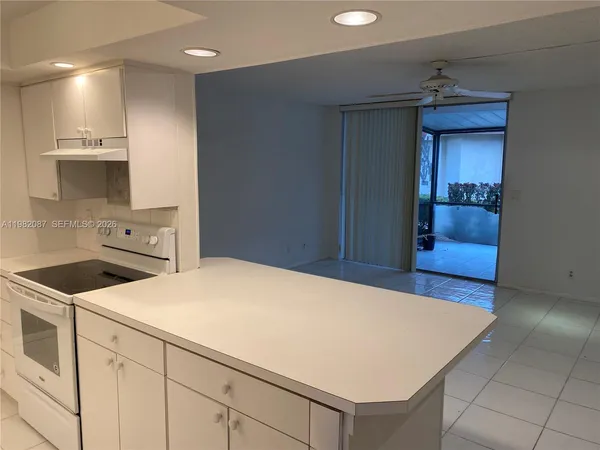 a kitchen with a stove and a refrigerator