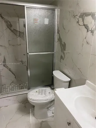 a bathroom with a sink and toilet