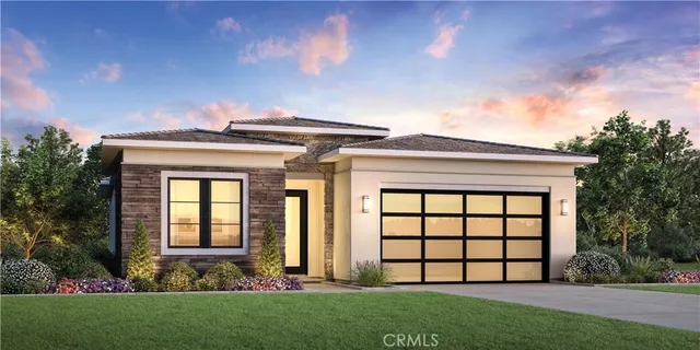 front view of a house with a garden