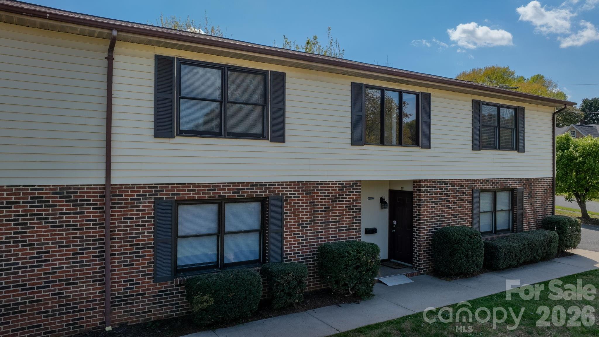 525 12th Street Southwest, Unit 30 Hickory, NC 28602 - Photo 1 of 22 a view of brick house with a large windows