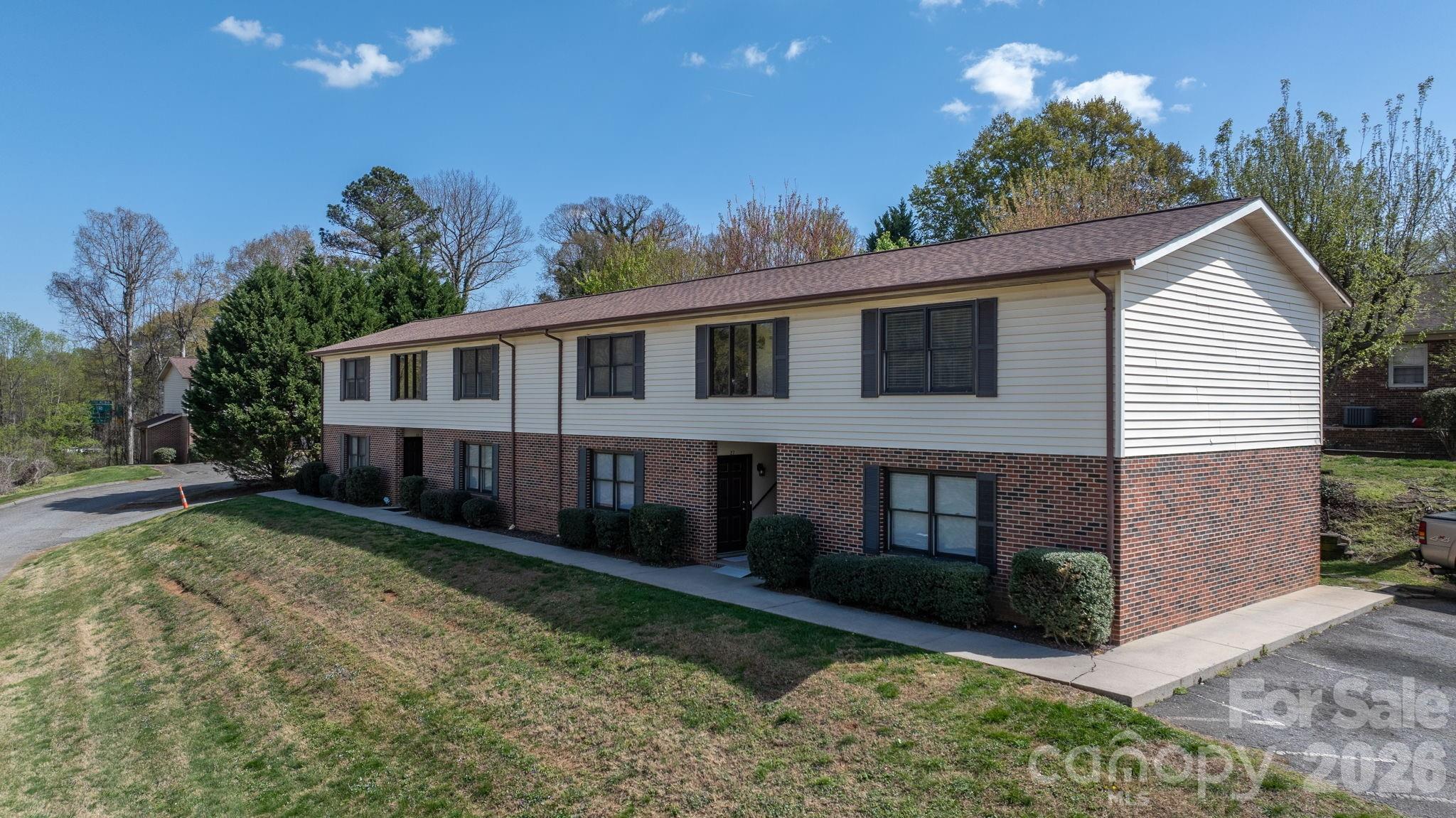 525 12th Street Southwest, Unit 30 Hickory, NC 28602 - Photo 16 of 22 a view of a house with a yard