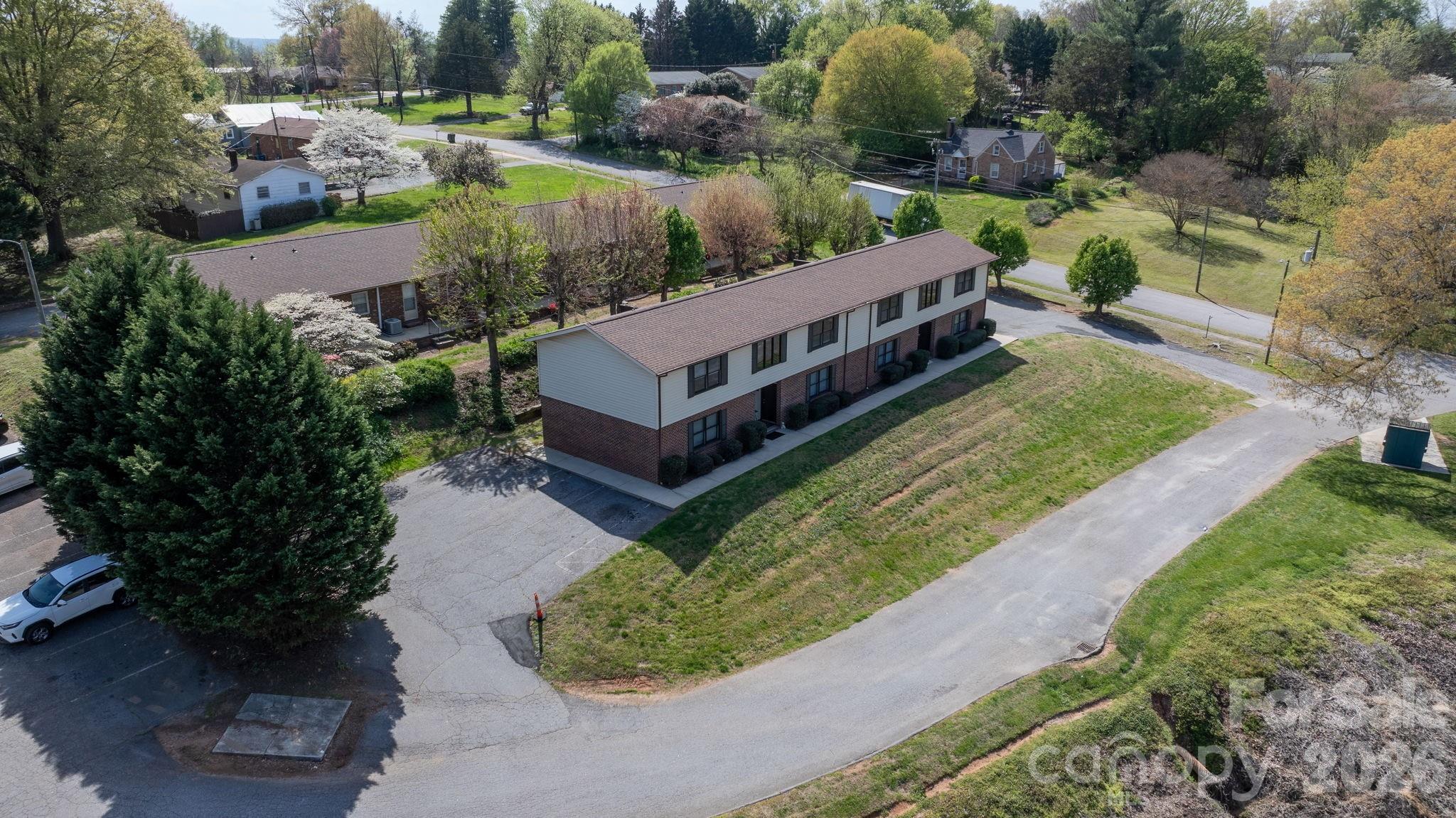 525 12th Street Southwest, Unit 30 Hickory, NC 28602 - Photo 17 of 22 a view of a house with a yard and outdoor seating
